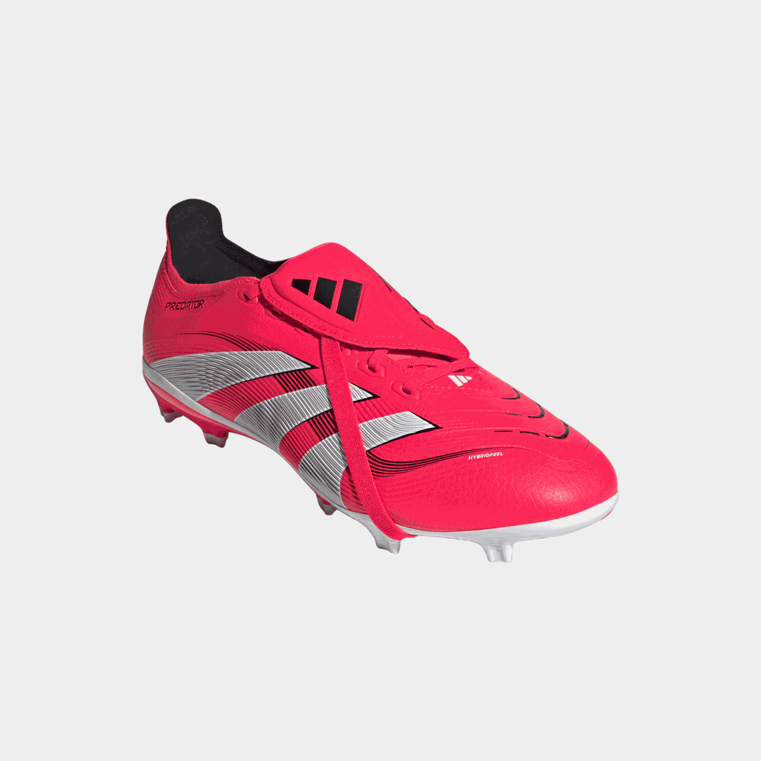 Buty piłkarskie Predator League z wywijanym językiem (FG/MG), przeznaczone do gry na naturalnej i syntetycznej trawie, unisex.