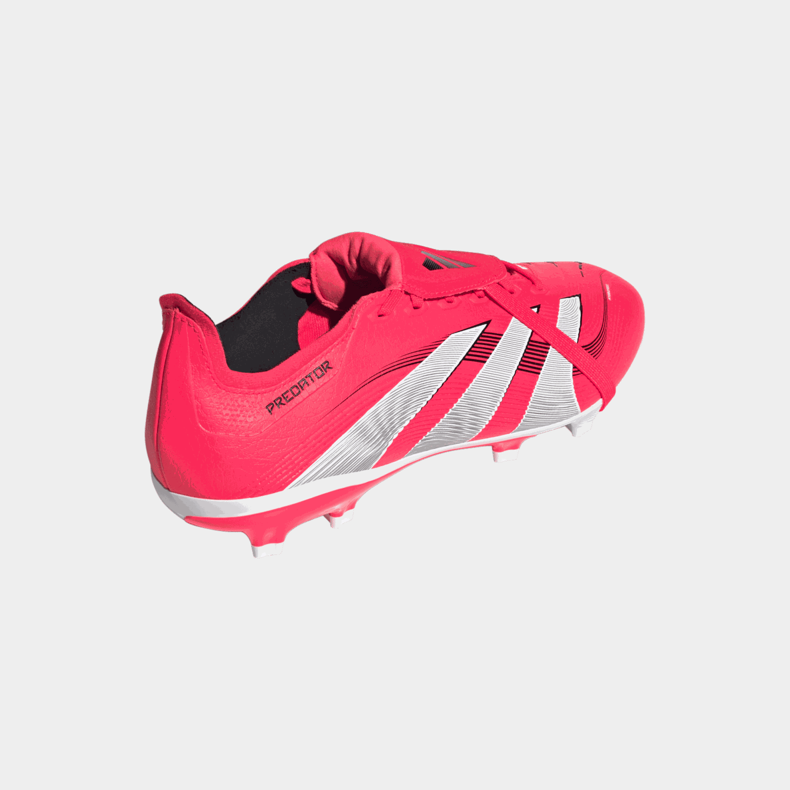 Buty piłkarskie Predator League z wywijanym językiem (FG/MG), przeznaczone do gry na naturalnej i syntetycznej trawie, unisex.
