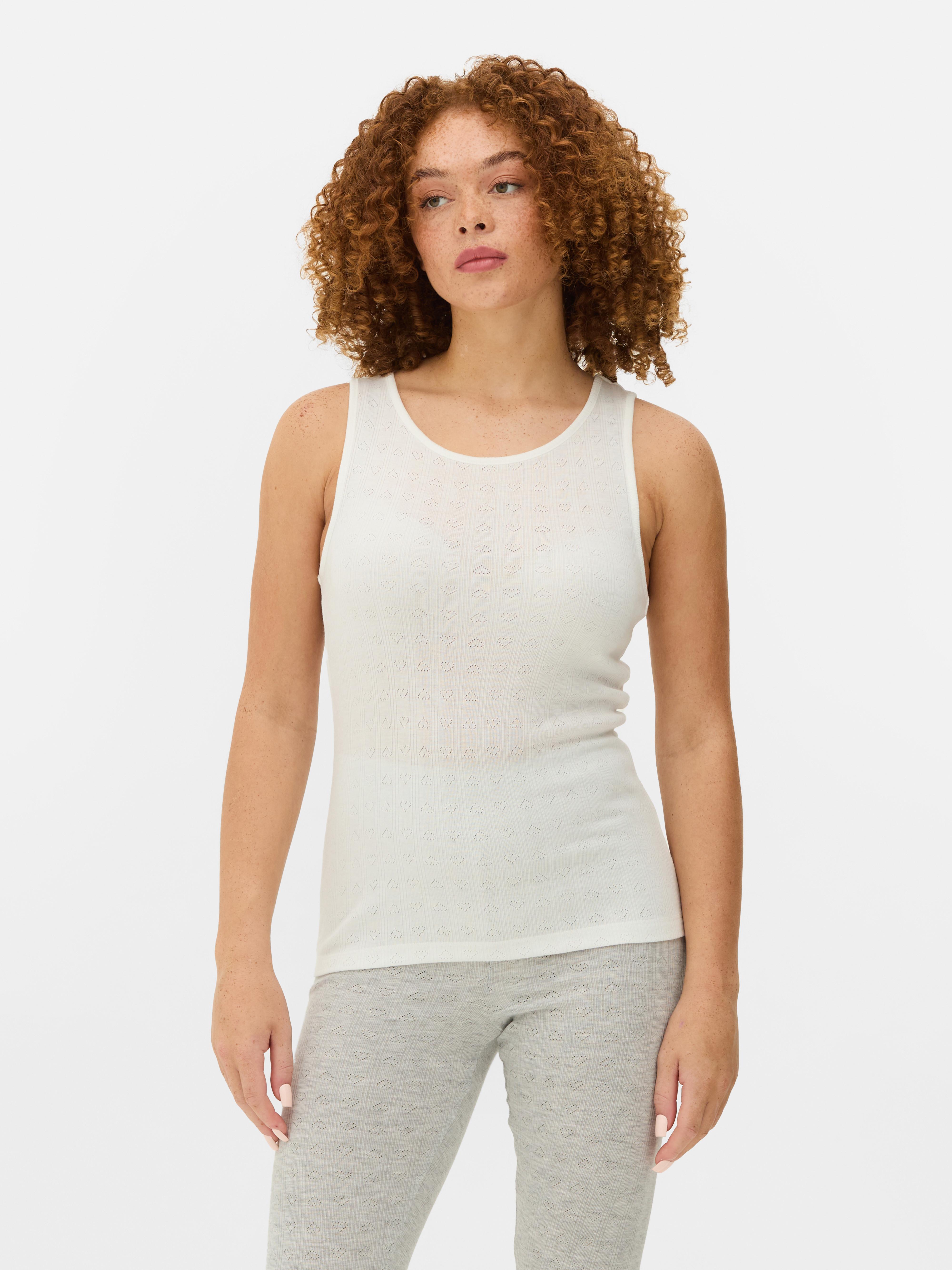 Thermoshirt mit Lochmuster. Halten Sie sich warm in dieser schmal geschnittenen Thermoweste mit gestricktem Lochmuster.