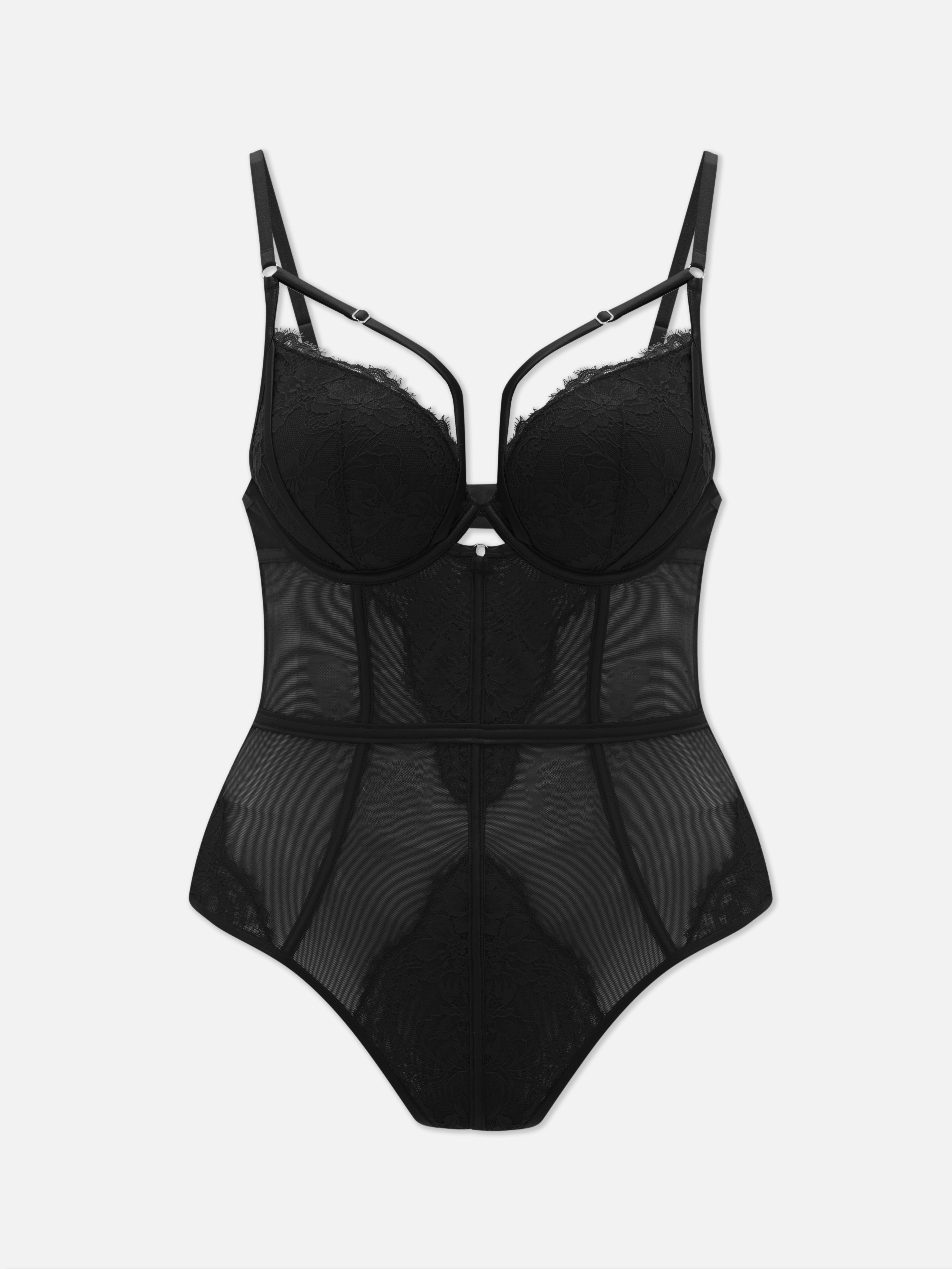 Body trasparente con inserti in pizzo. Un body con coppe strutturate e dettagli in pizzo.