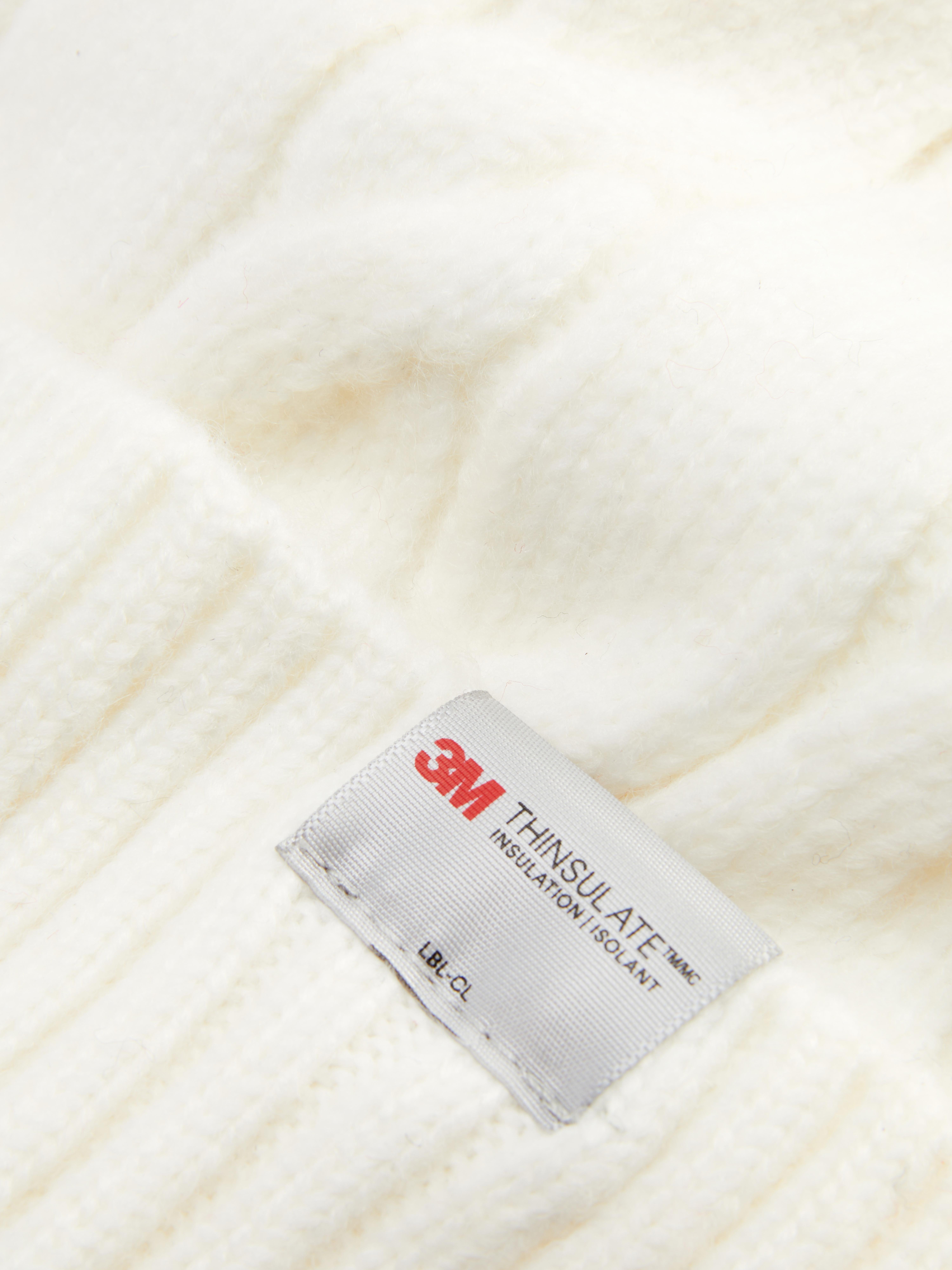 Pletena kapa Thinsulate Mehka pletena kapa z zavihanim robom in izolacijskimi lastnostmi