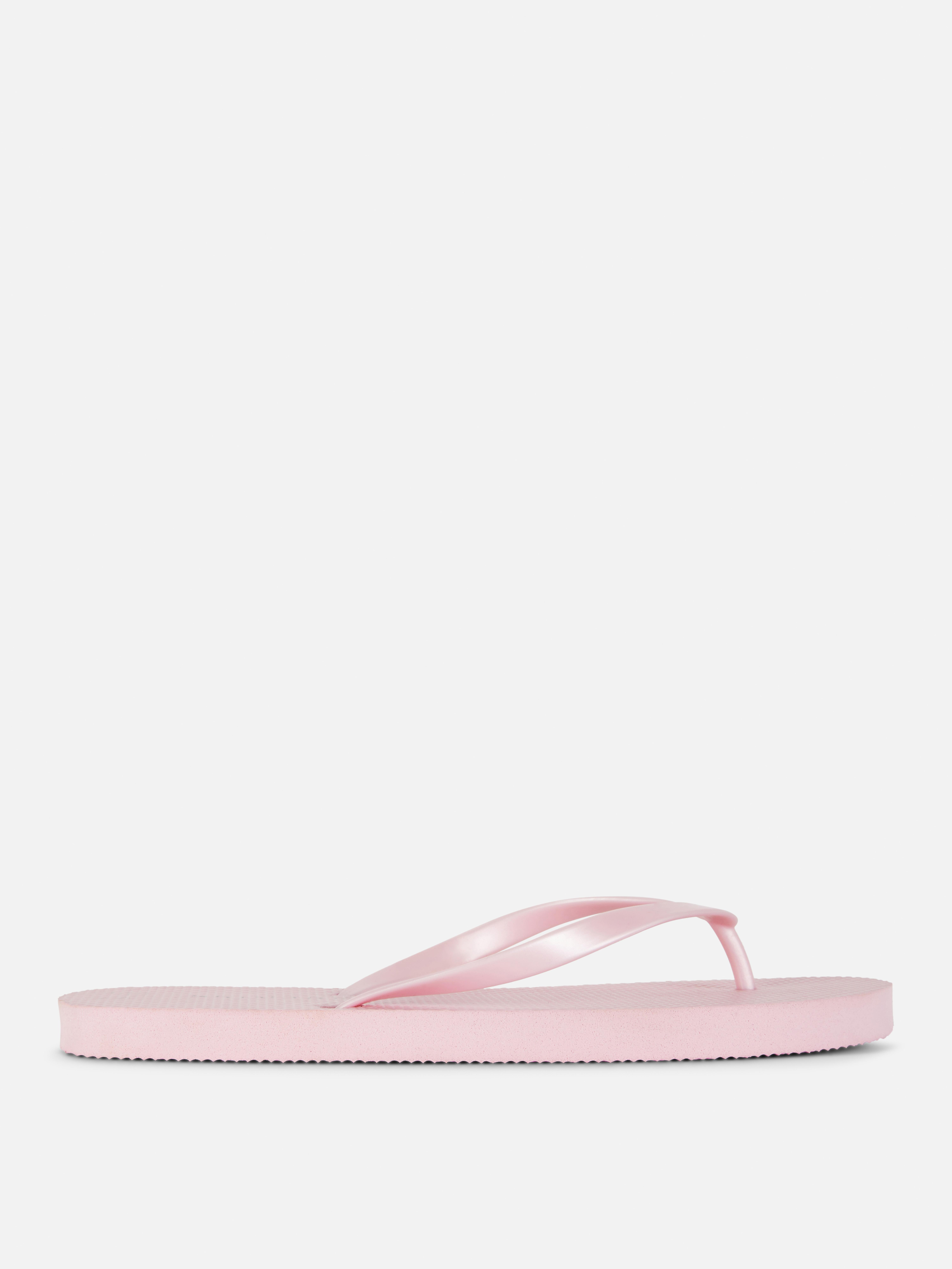 Flip-flops clasici O pereche de flip-flops simpli cu barete înguste și talpă plată