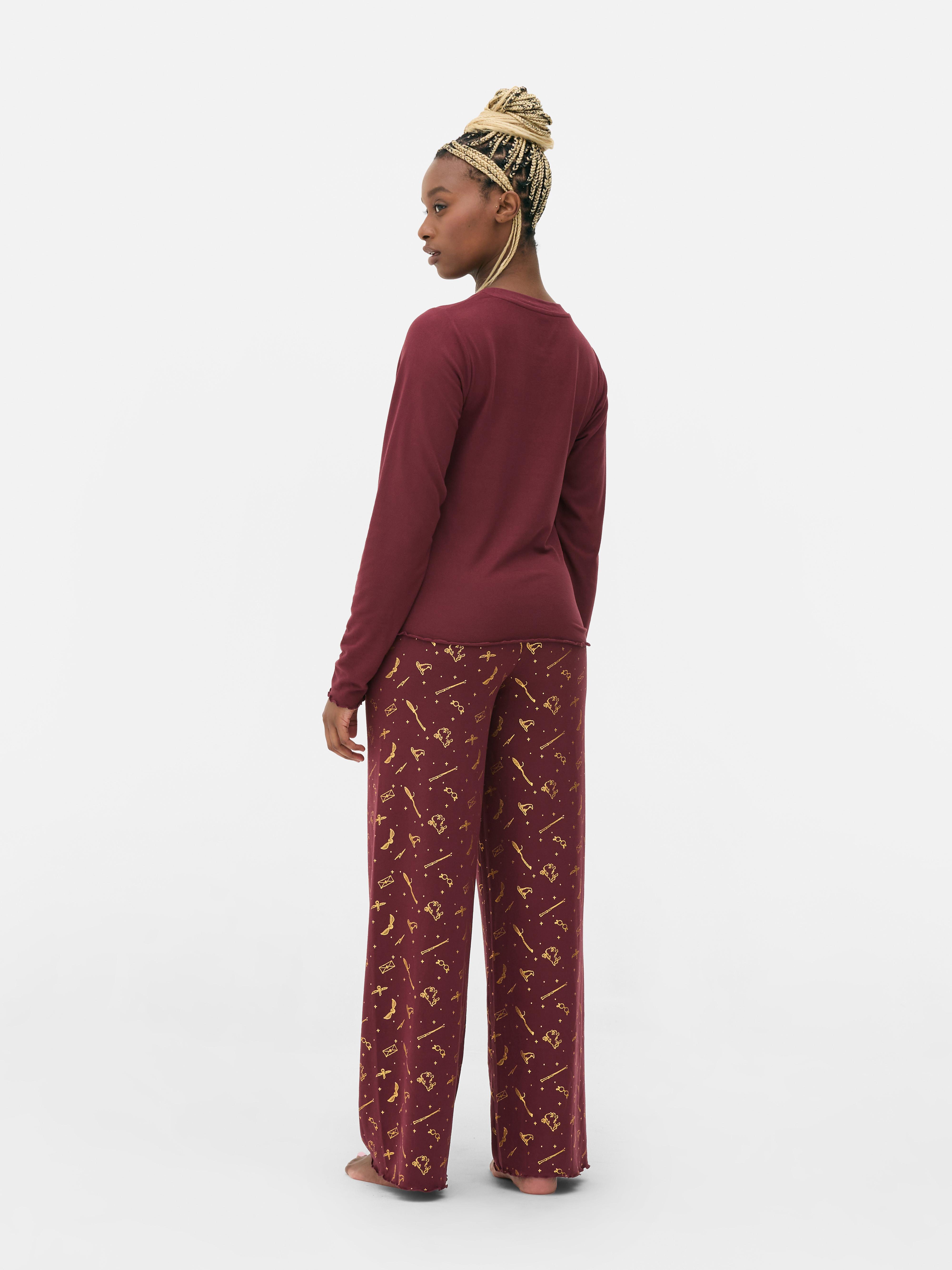 Pijamale Harry Potter™ cu Casele de la Hogwarts Pijamale cu top cu mânecă lungă și pantaloni cu casele de la Hogwarts