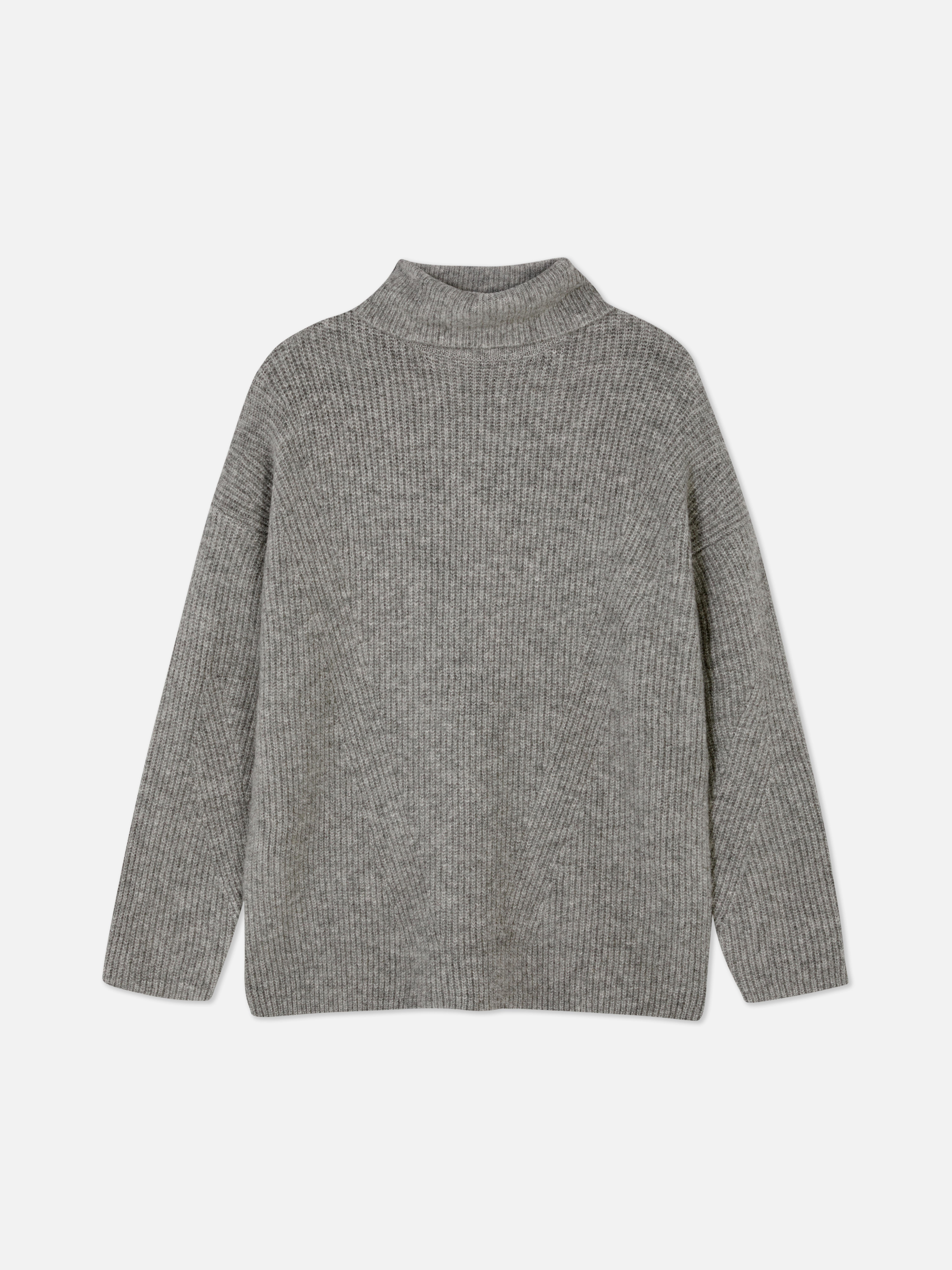 Αυτό το oversized ζιβάγκο με ριμπ ύφανση έχει χαμηλωμένα μανίκια