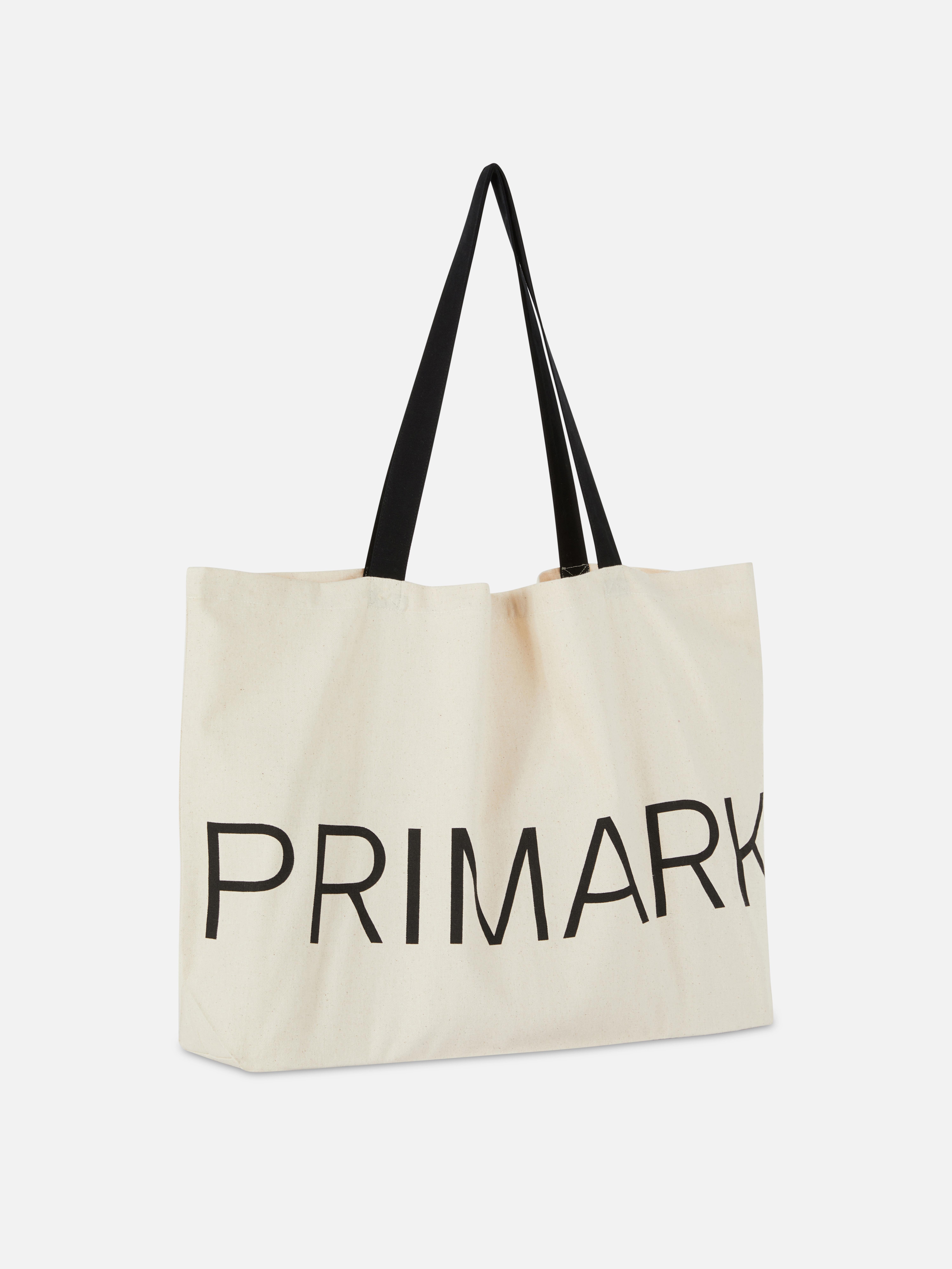 Geantă tote din pânză imprimată Primark. Geantă clasică din pânză, perfectă pentru o zi de cumpărături sau o scurtă treabă.
