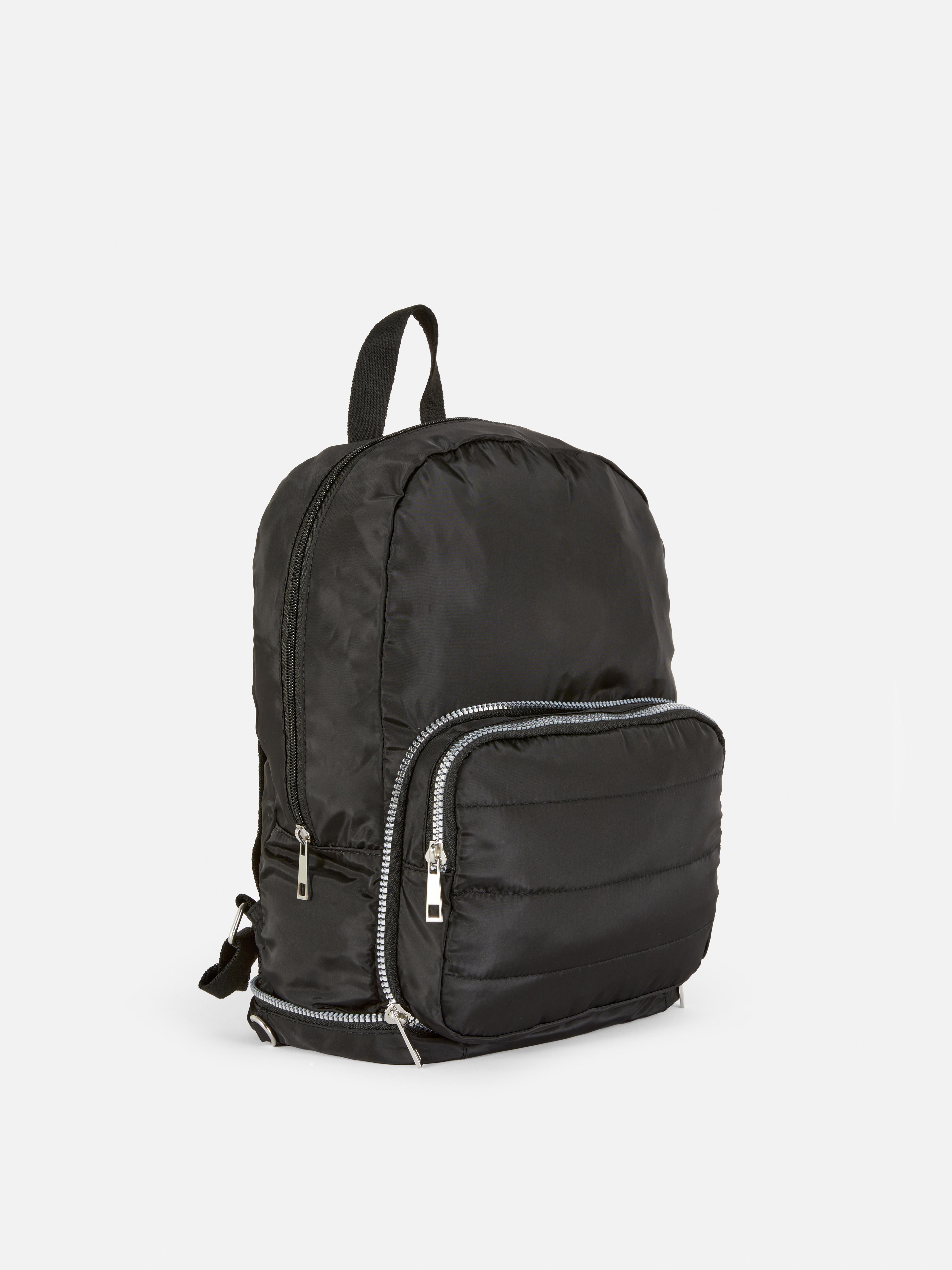Geantă căptușită două într-unul. Un rucsac și o geantă crossbody într-o singură geantă elegantă.