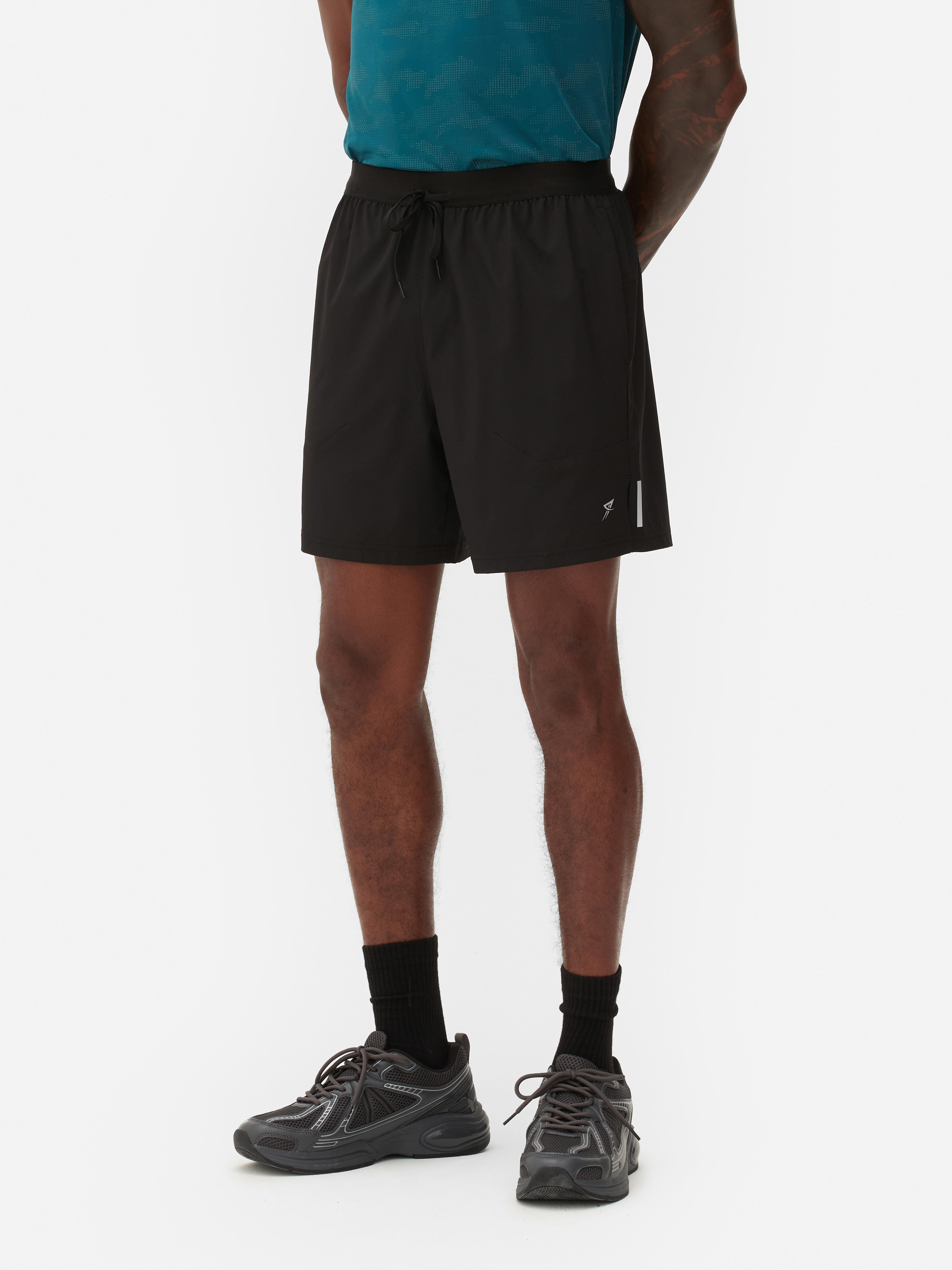 Pantaloni scurți de alergare cu talie elastică Pantaloni scurți sport de alergare cu talie elastică și buzunare multiple