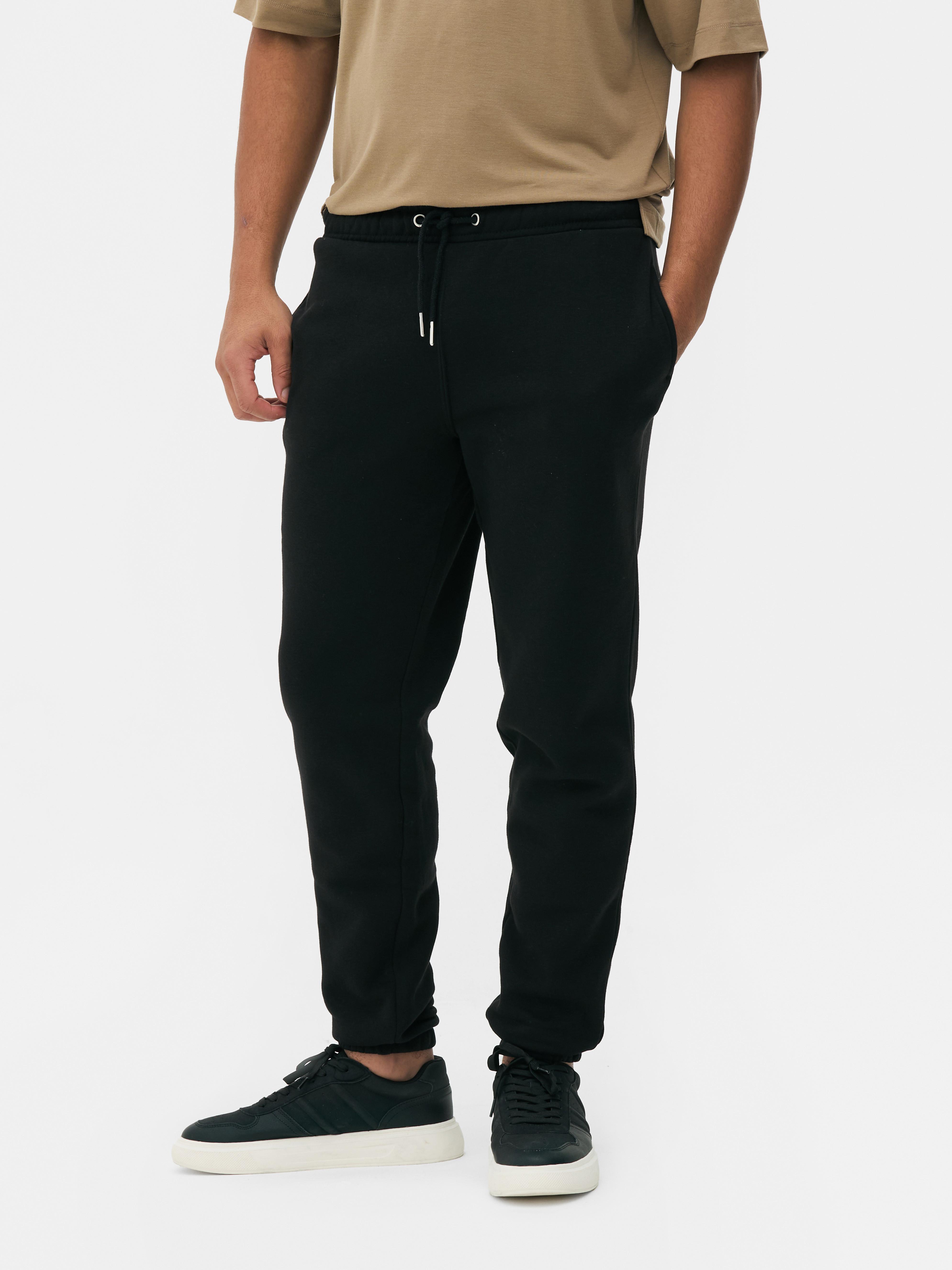 Pantaloni de jogging cu talie elastică și manșete la gleznă Pantaloni de jogging cu manșete la gleznă și talie elastică cu șnur de strângere