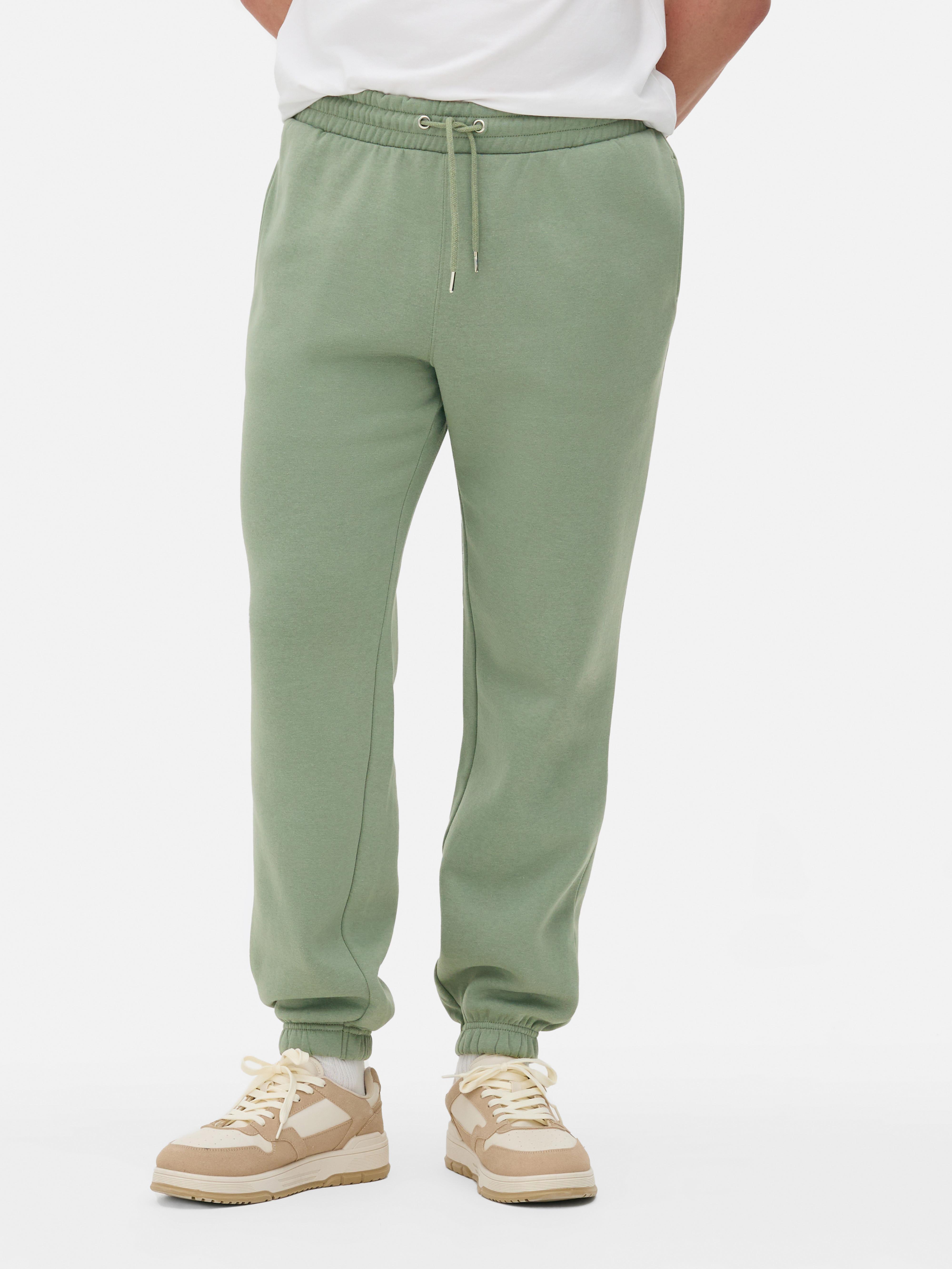 Pantaloni de jogging esențiali cu șnur de strângere Acești pantaloni de jogging confortabili cu șnur de strângere și buzunar aplicat la spate sunt casual și potriviți pentru relaxare