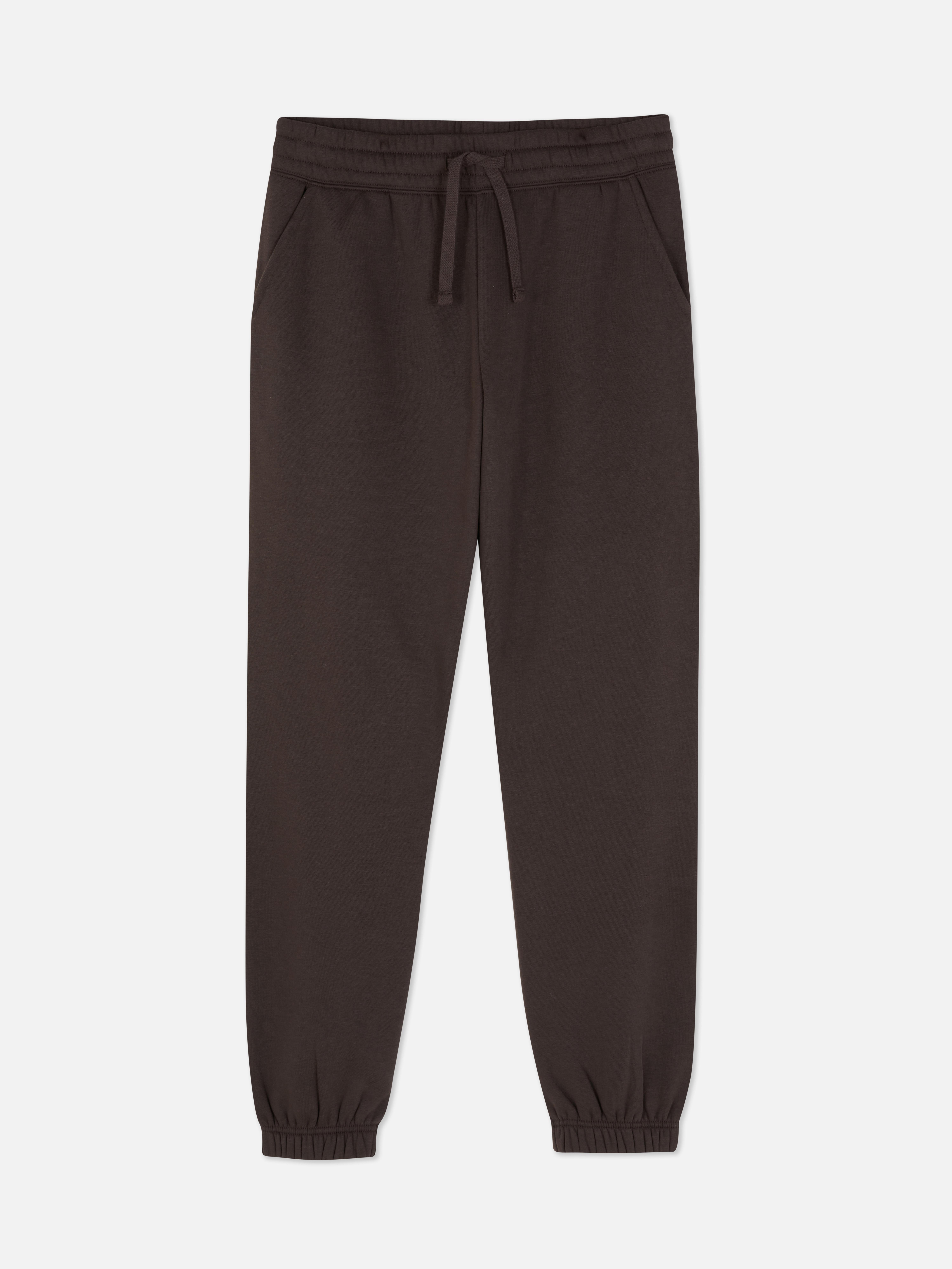 Pantaloni de jogging simpli cu croială regulată. Acești pantaloni de jogging cu manșete până la gleznă sunt indispensabili în garderoba ta casual.