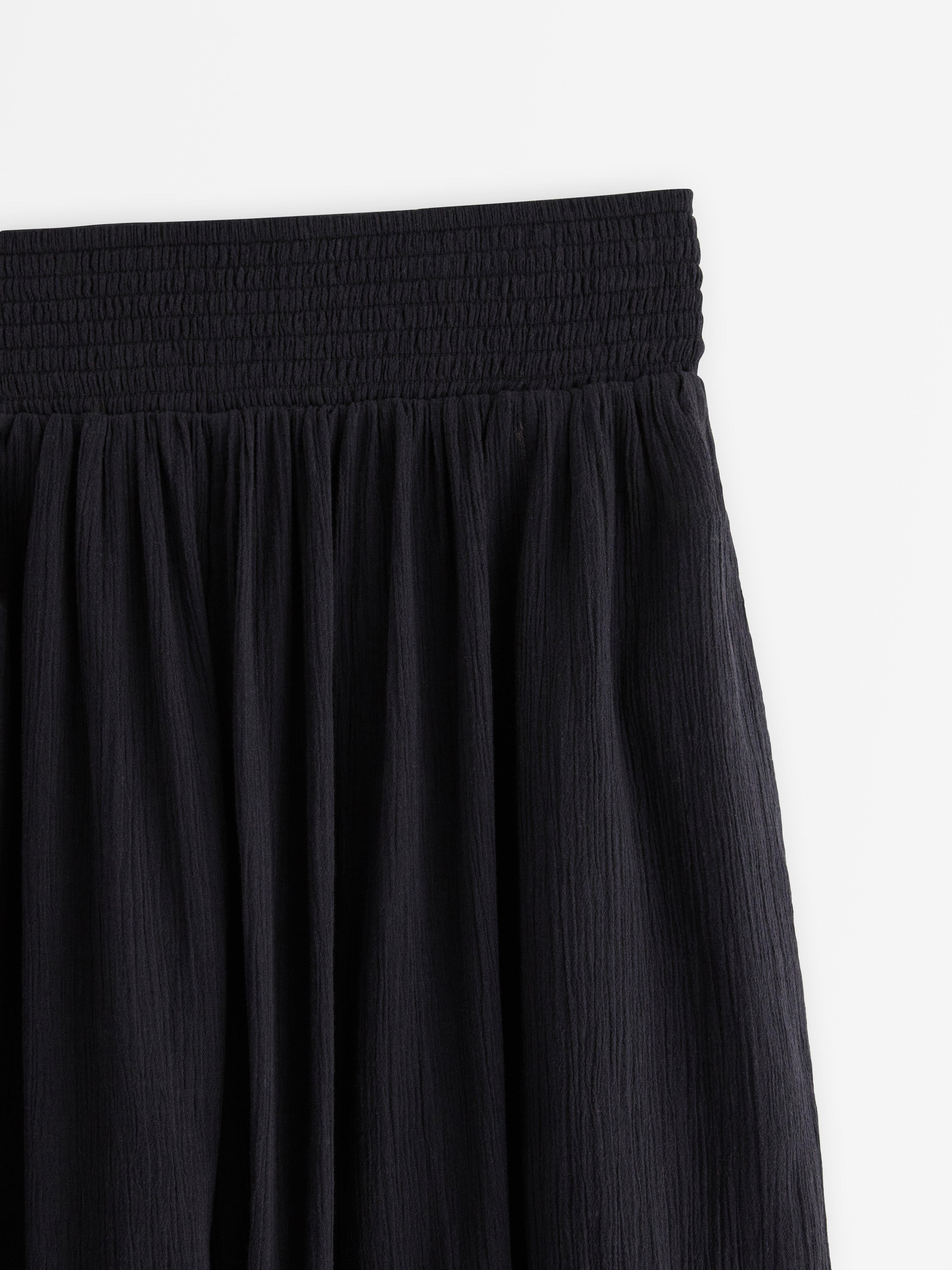 Pantalones anchos tobilleros negros