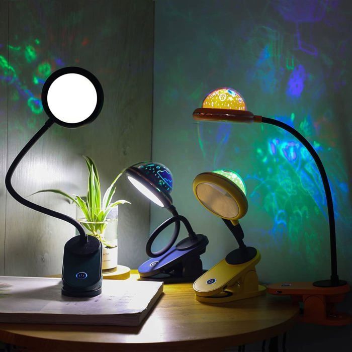 Lámpara infantil con pinza, lámpara de lectura LED recargable por USB con proyección de estrellas e intensidad regulable mediante tacto.