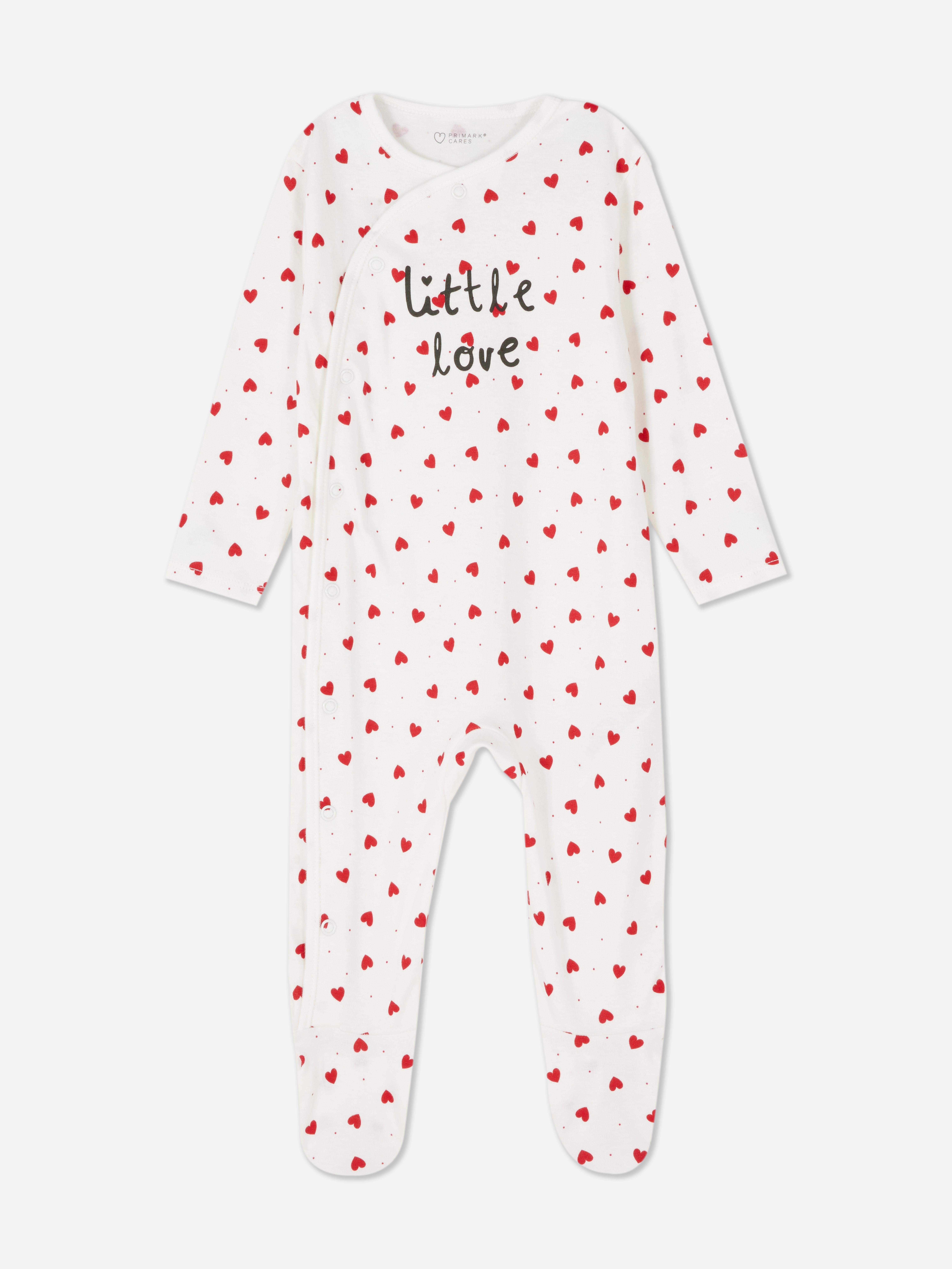 Pijama înfășurată cu inimioare. Un pijama cu model înfășurat, mâneci lungi și model cu picioare.
