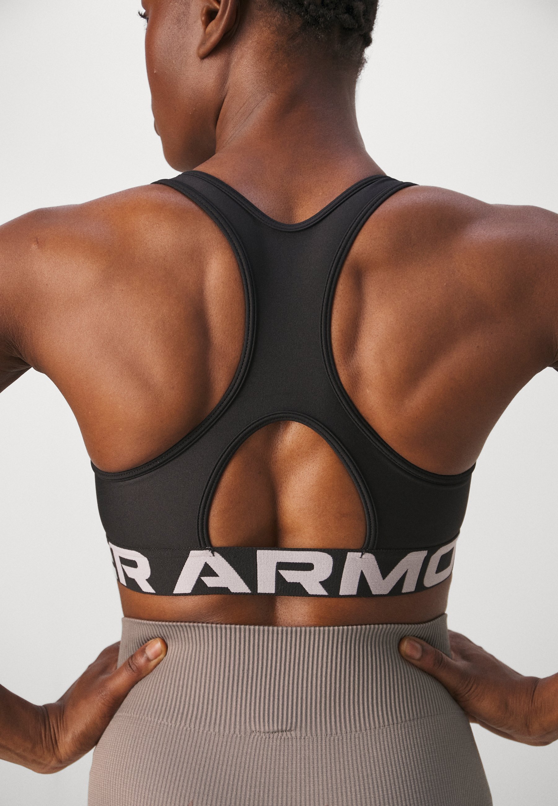 Soutien-gorge de sport Under Armour MID BRANDED - Maintien moyen - Noir/Blanc
