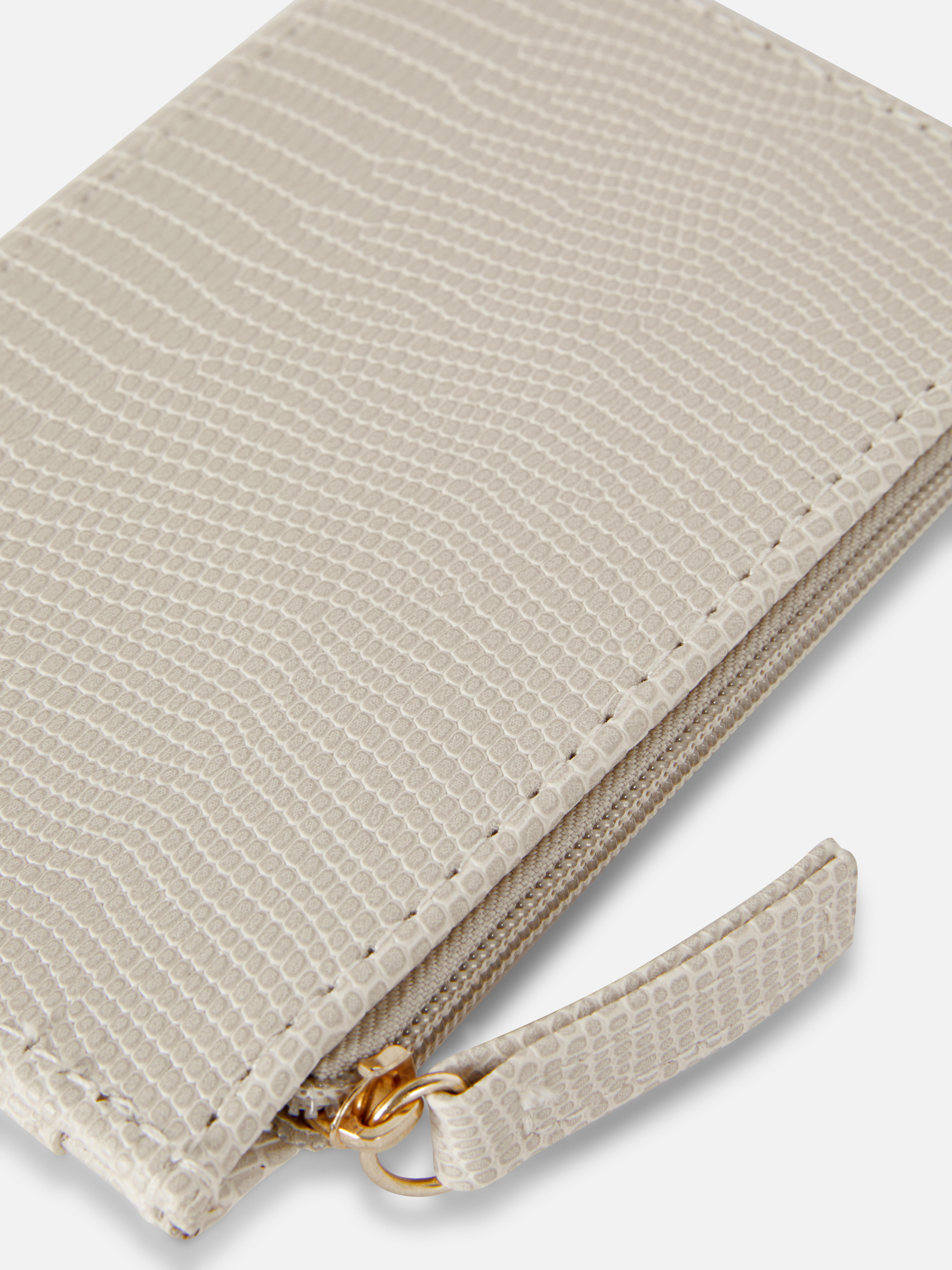 Portcard cu textură de piele de șarpe. Portcard elegant și compact, cu compartiment cu fermoar, ca alternativă la portofelul clasic.