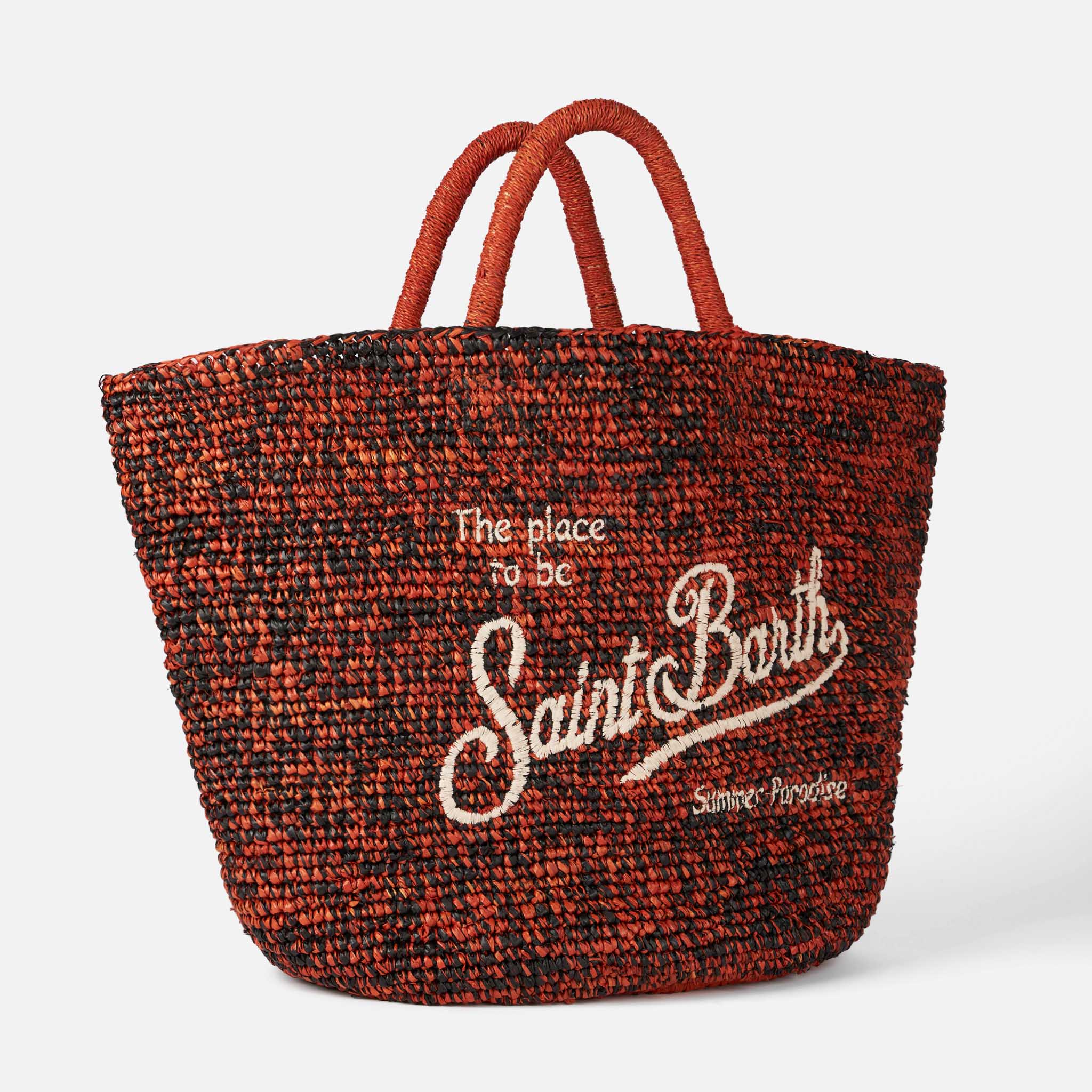 Bolso de rafia negro y naranja con bordado frontal.