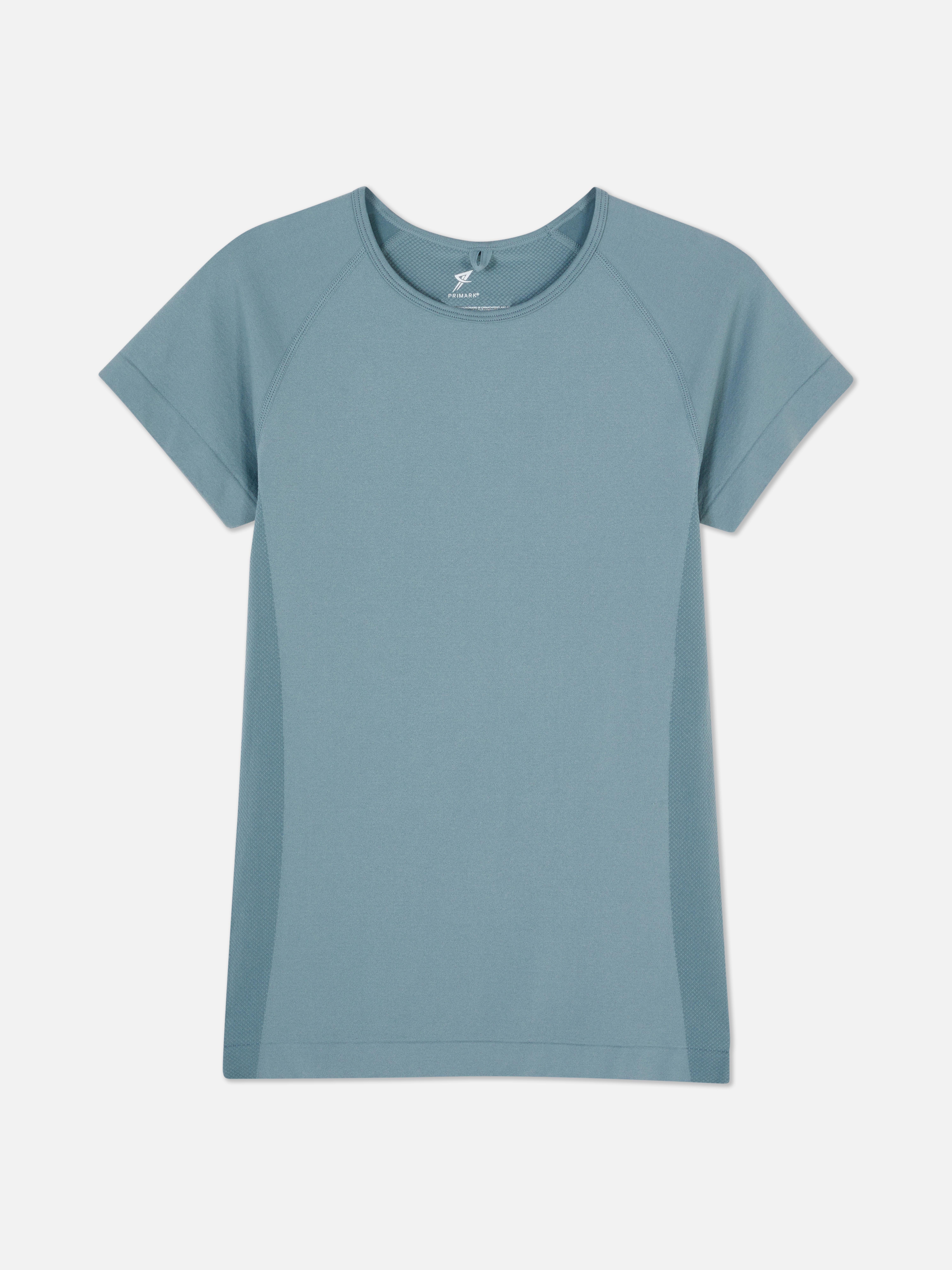 Top sport cu mânecă scurtă, fără cusături. Un top sport cu decolteu rotund, mâneci scurte și material elastic.