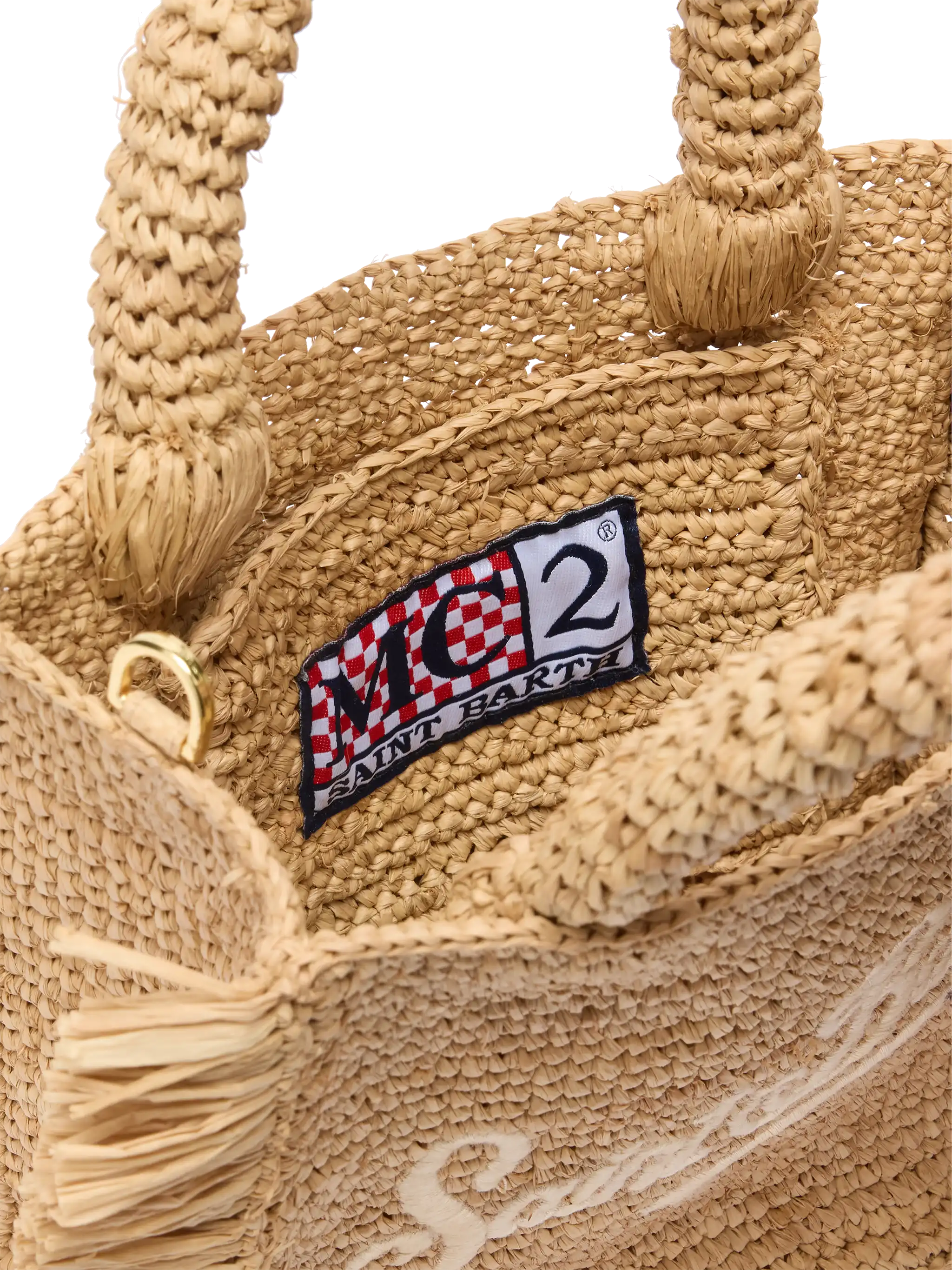 Mini toilettasje van raffia met franjes en borduurwerk in Saint Barth-stijl.