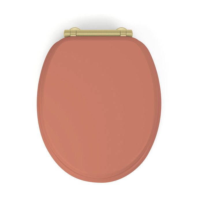 Asiento de inodoro Samba de MDF color terracota, de liberación rápida y cierre suave.