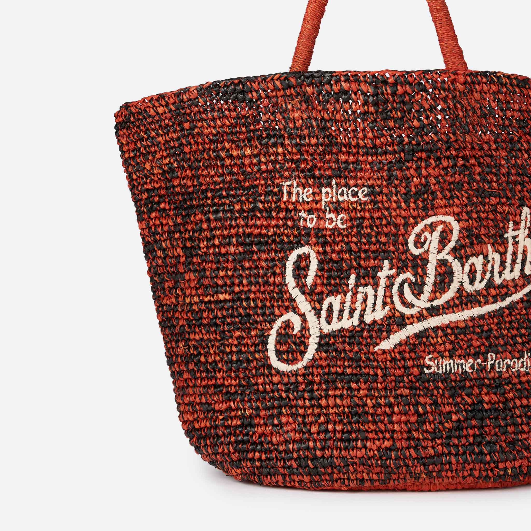 Sac en raphia noir et orange avec broderie sur le devant