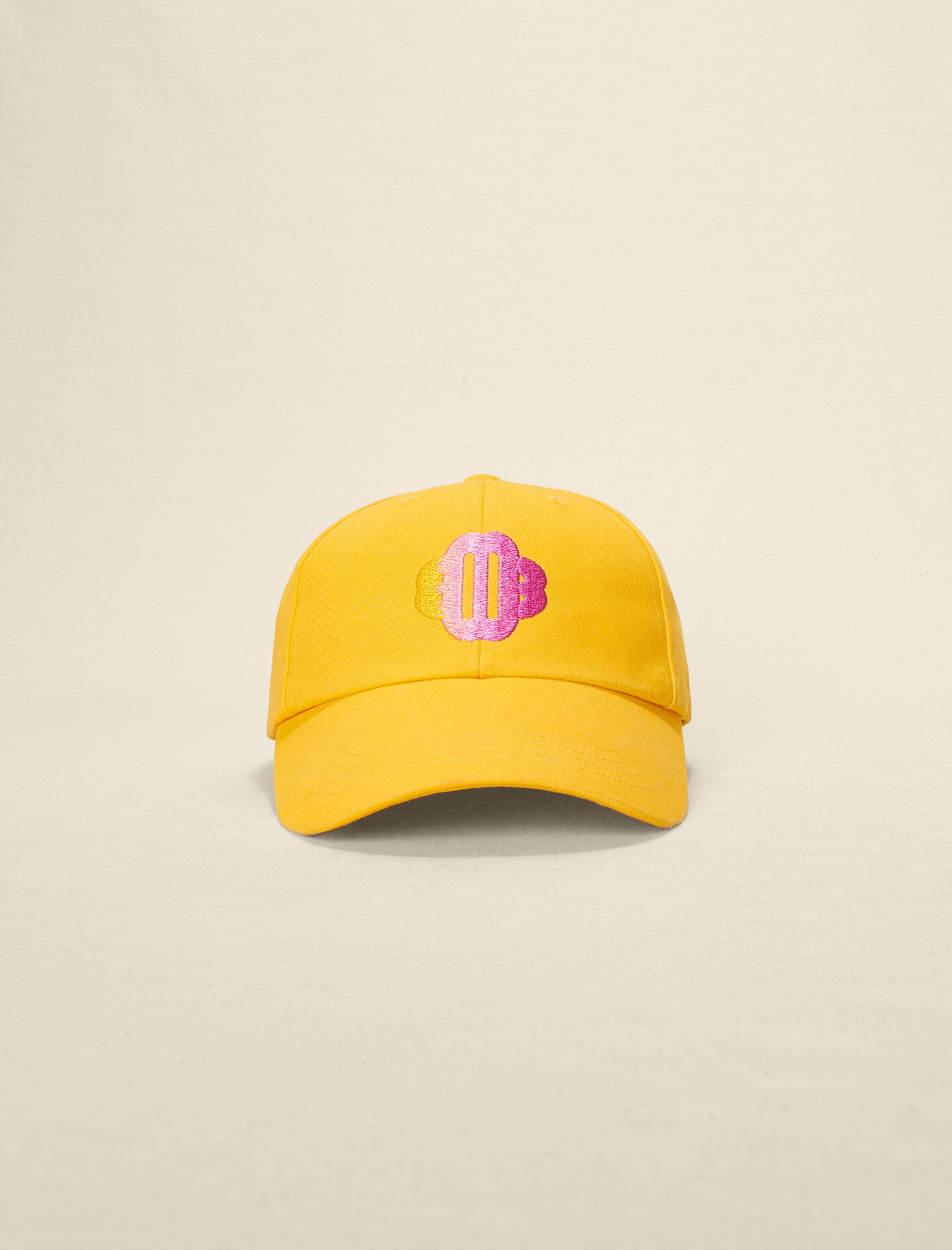 Katoenen pet met het Clover-Jaune soleil logo.