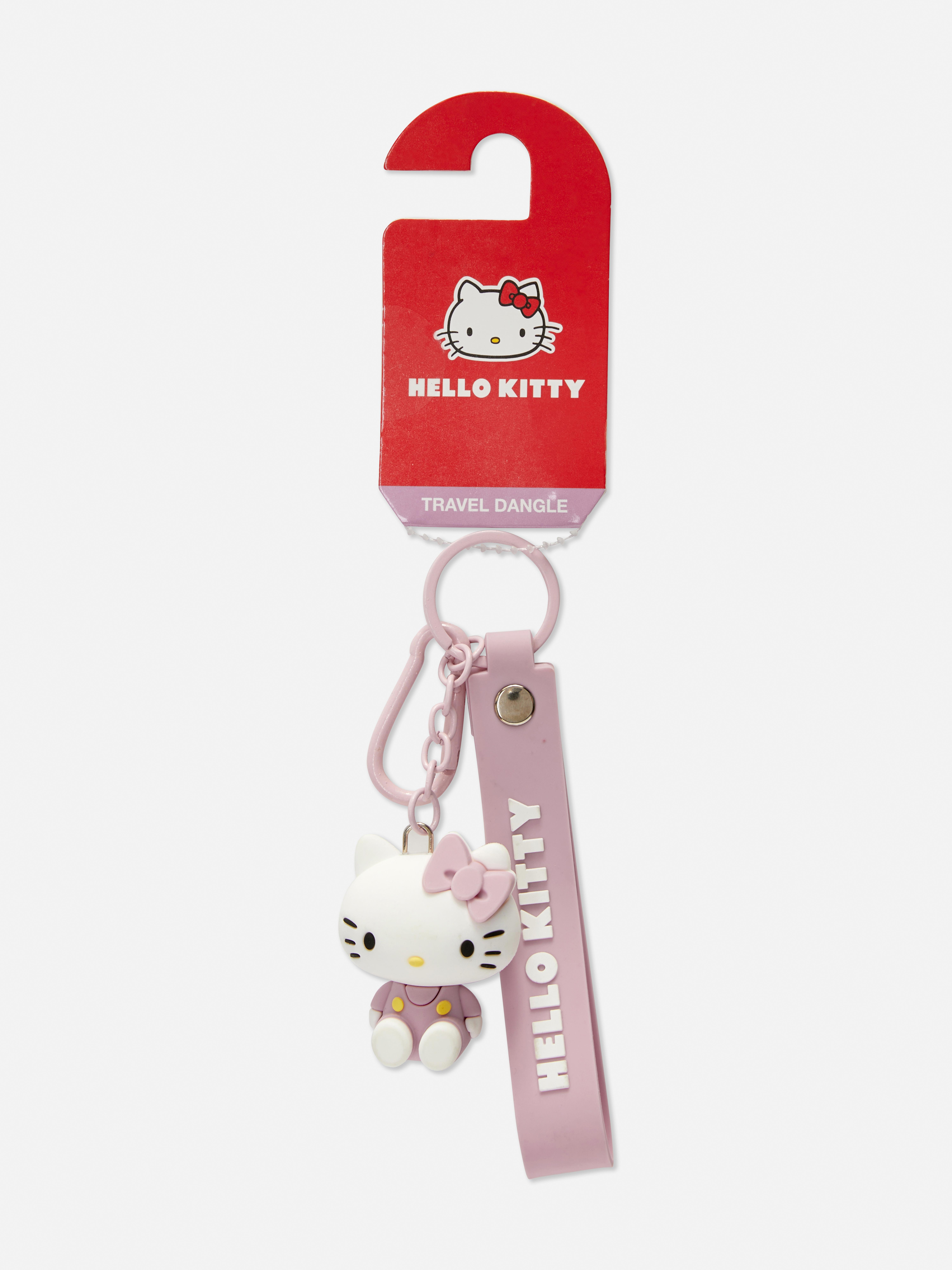 Breloc de călătorie Hello Kitty Un breloc de călătorie cu pandantiv și etichetă cu nume Hello Kitty