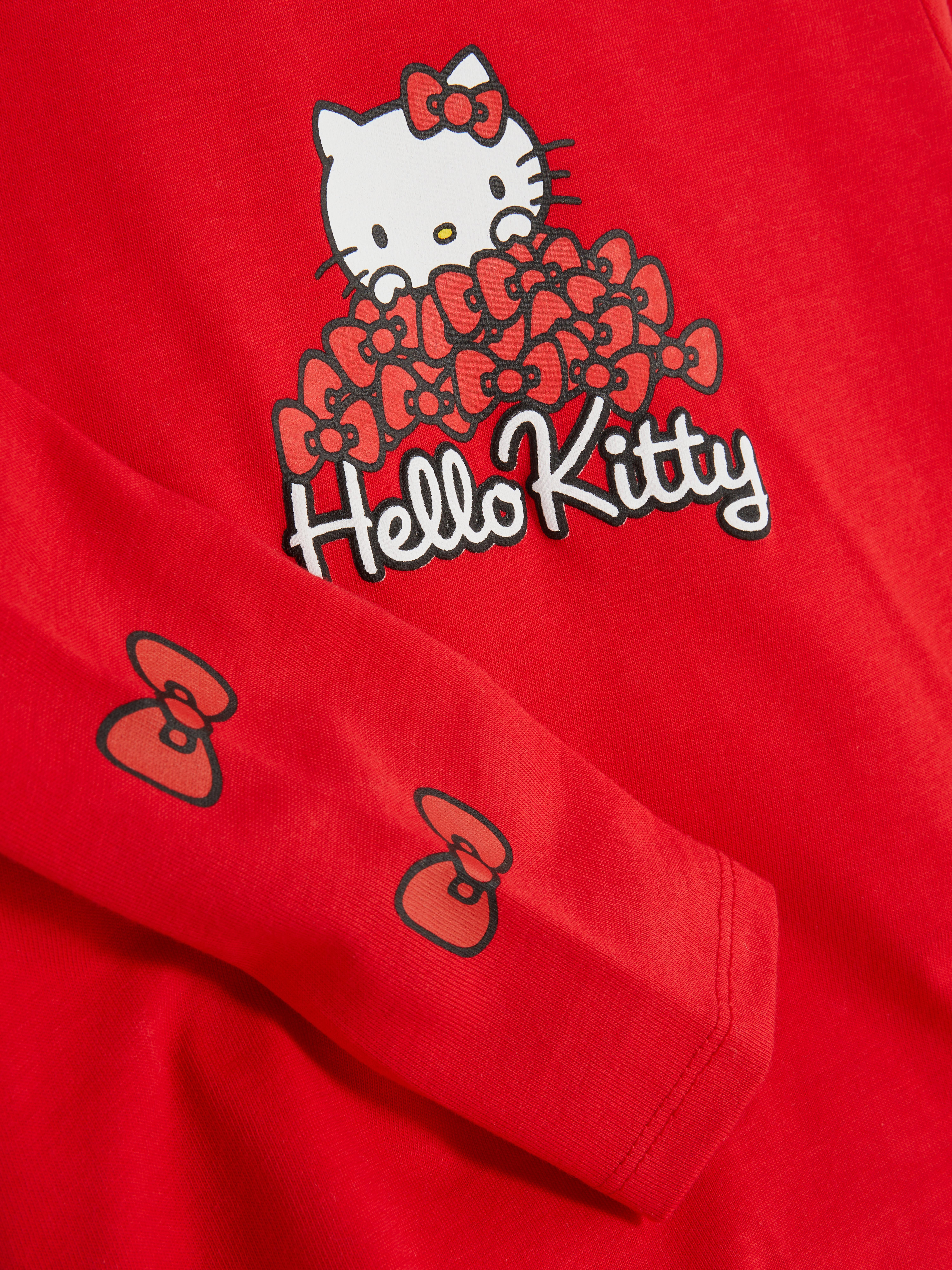 Hello Kitty Langarmshirt Dieses Langarmshirt mit Rundhalsausschnitt hat einen Hello Kitty-Aufdruck auf der Vorderseite.