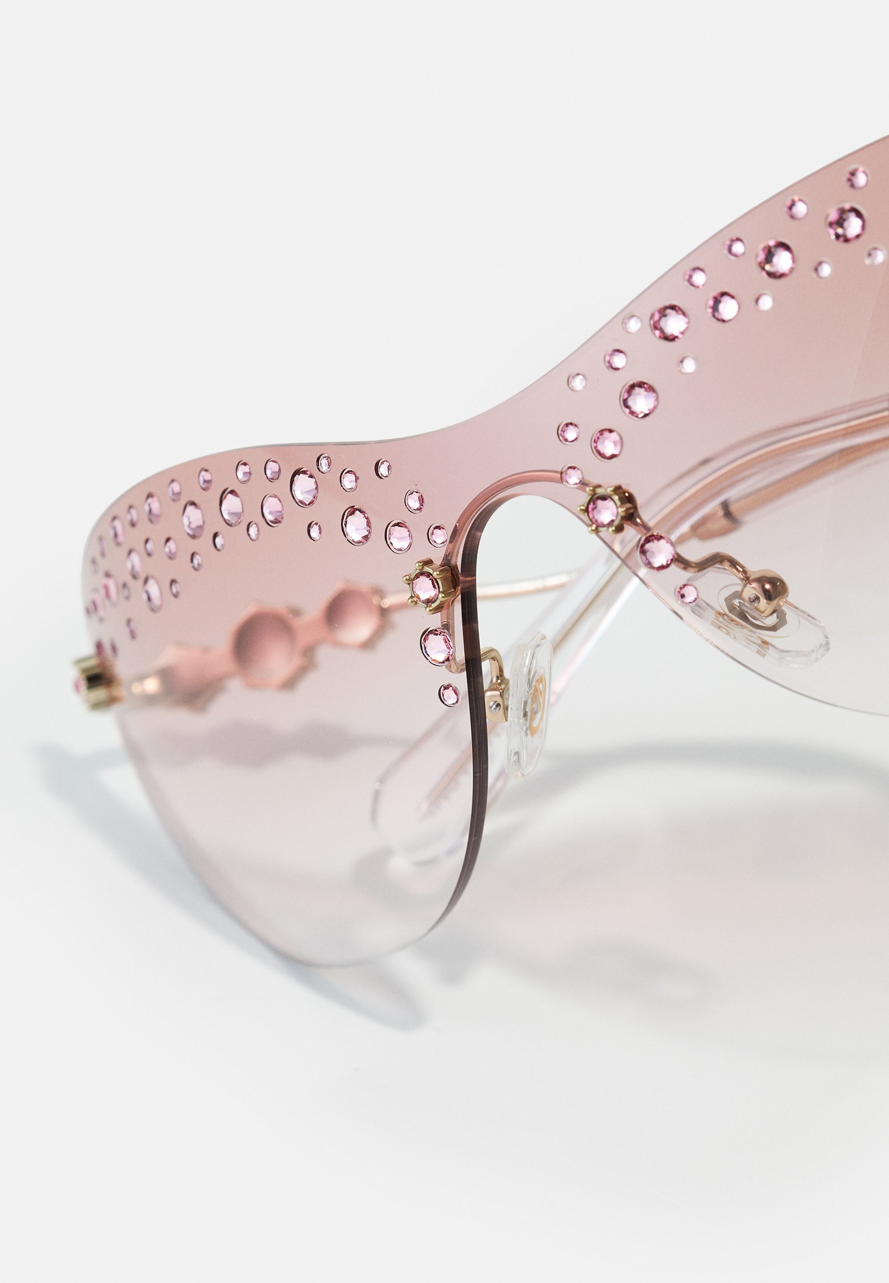 Slnečné okuliare Swarovski - svetlozlaté/číre ružové s prechodom