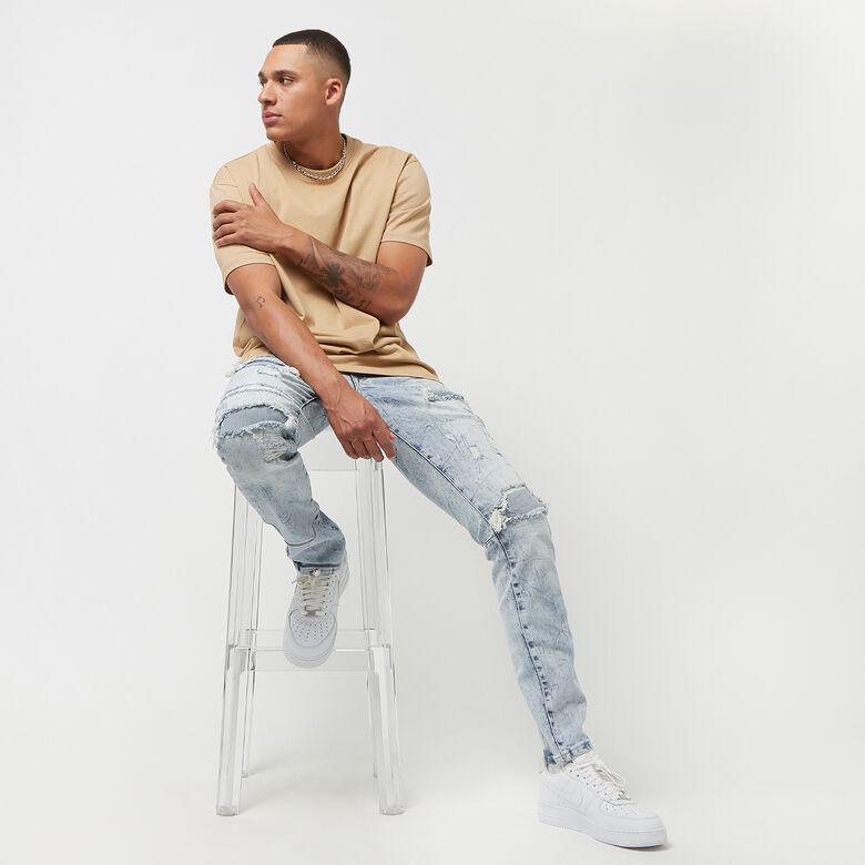 Gebleekt, gewassen, gescheurde en gerepareerde jeans