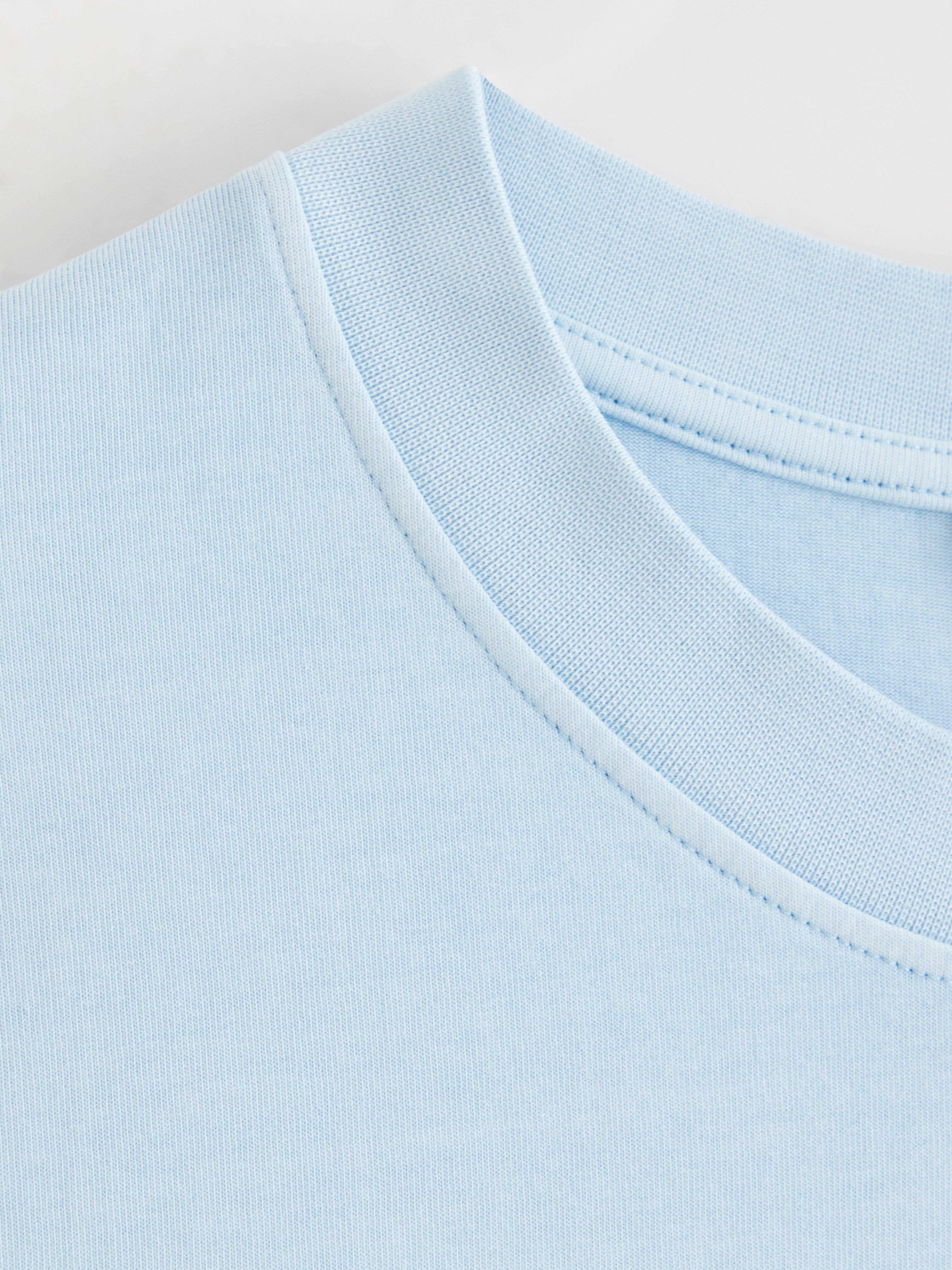 Camiseta oversized azul claro