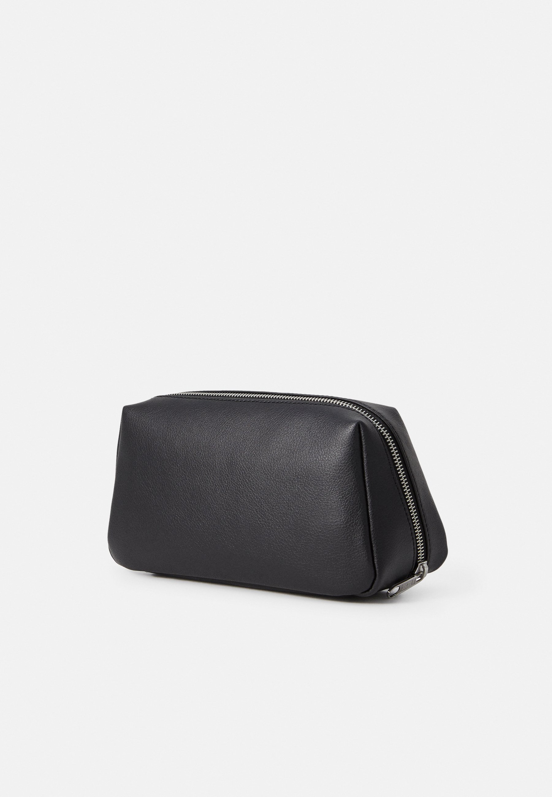 Tommy Jeans Waschtasche mit linearem Logo – schwarz