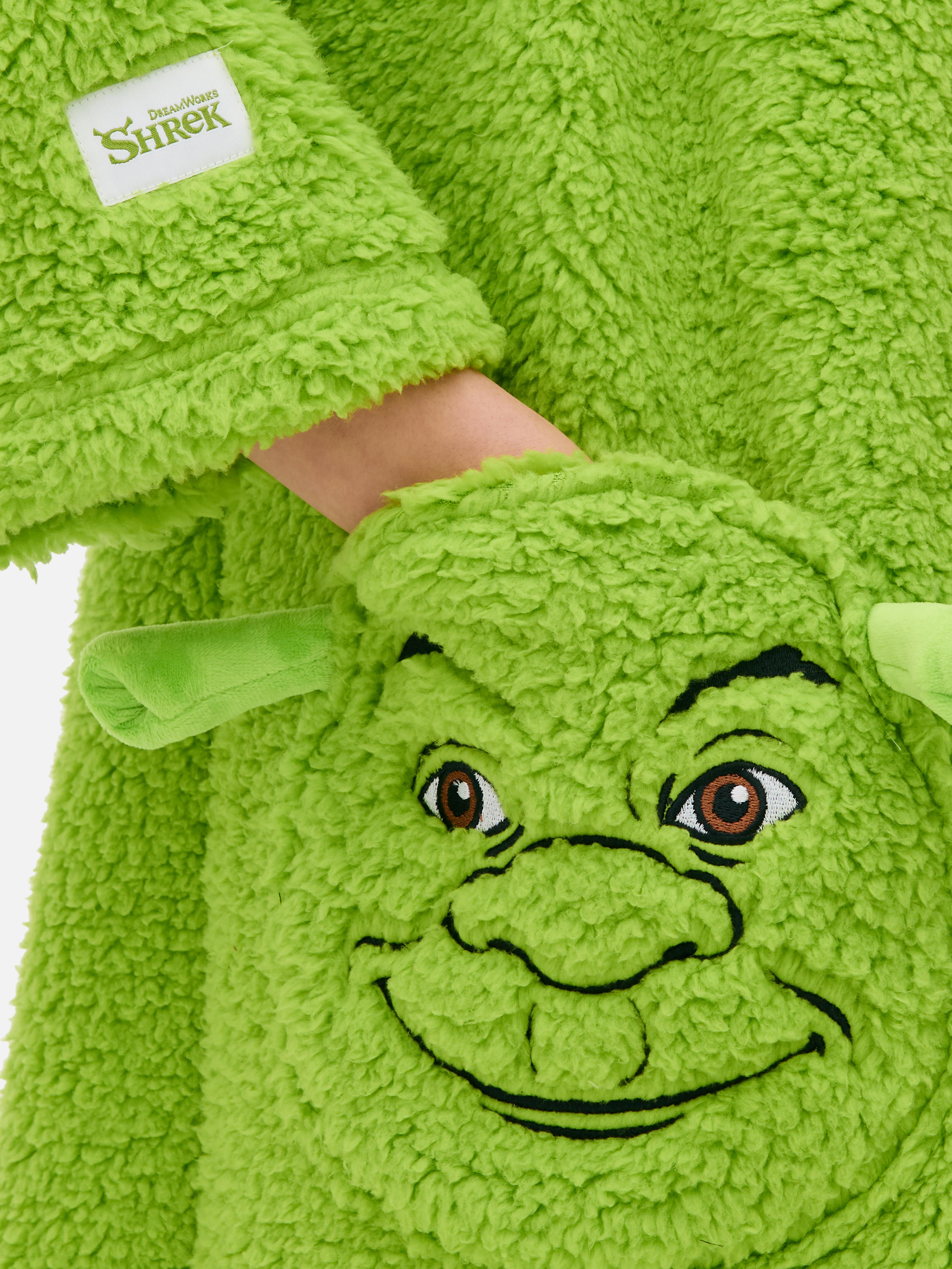 Hosszú női Shrek mintás snuddie. Hosszú Shrek snuddie tágas kapucnival, elülső cipzárral és foltzsebekkel.
