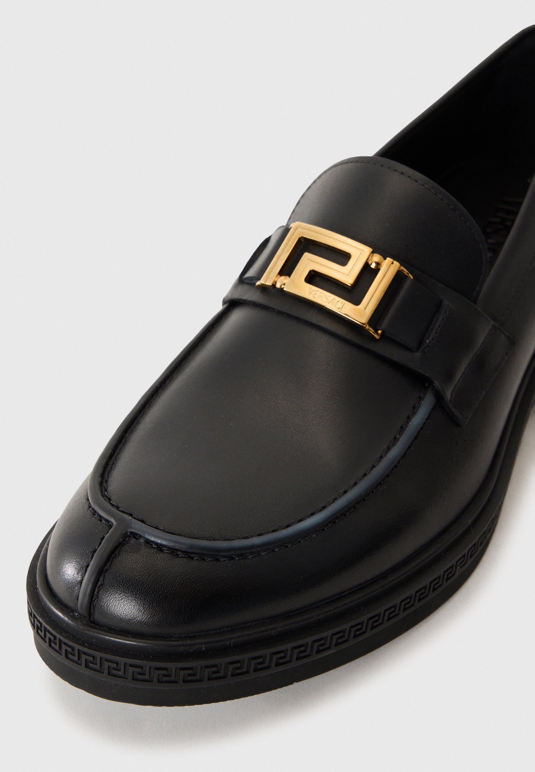 Versace instappers - zwart/goudkleurig