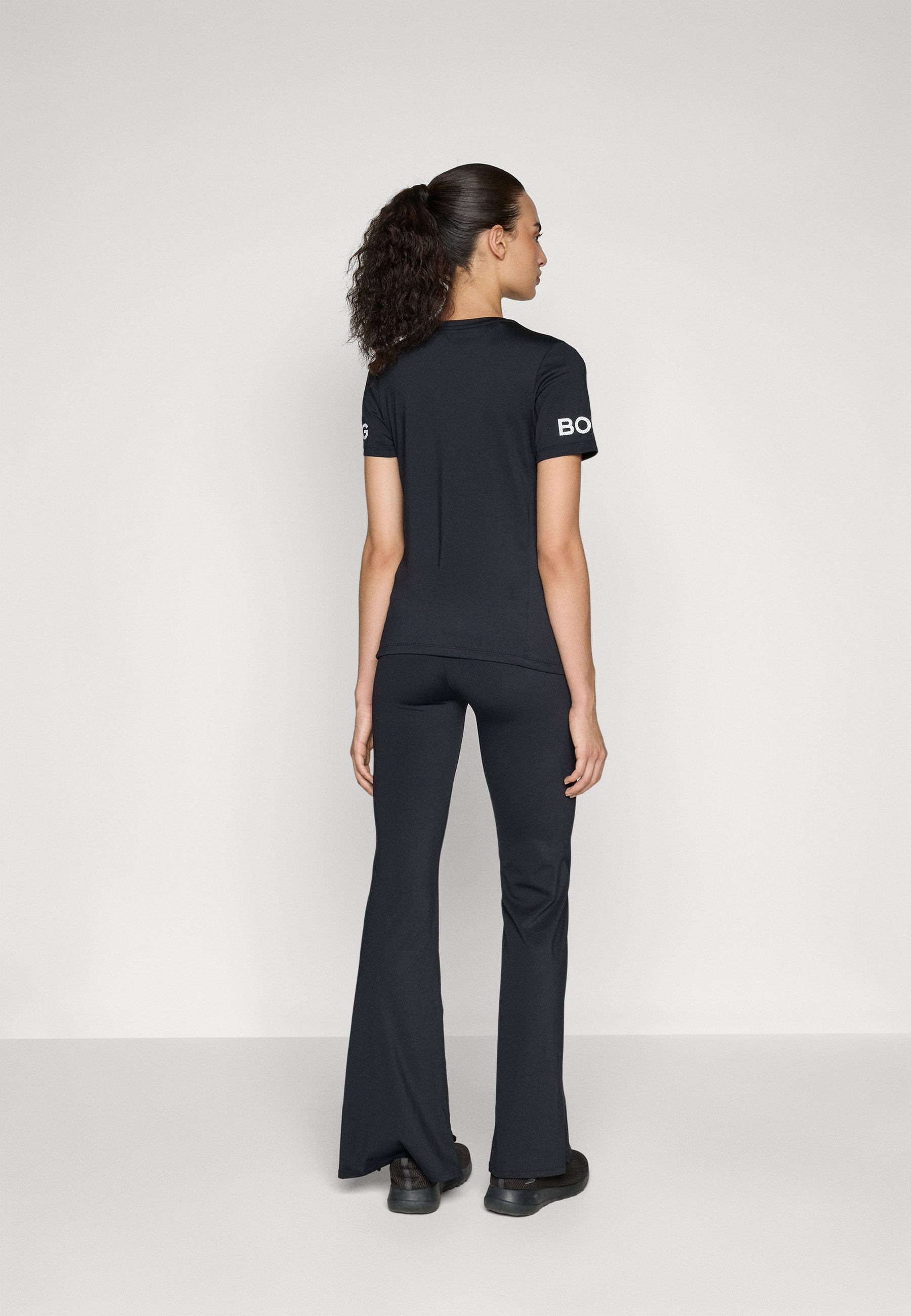 Björn Borg STUDIO FLARED SLIT - Leggings - black beauty