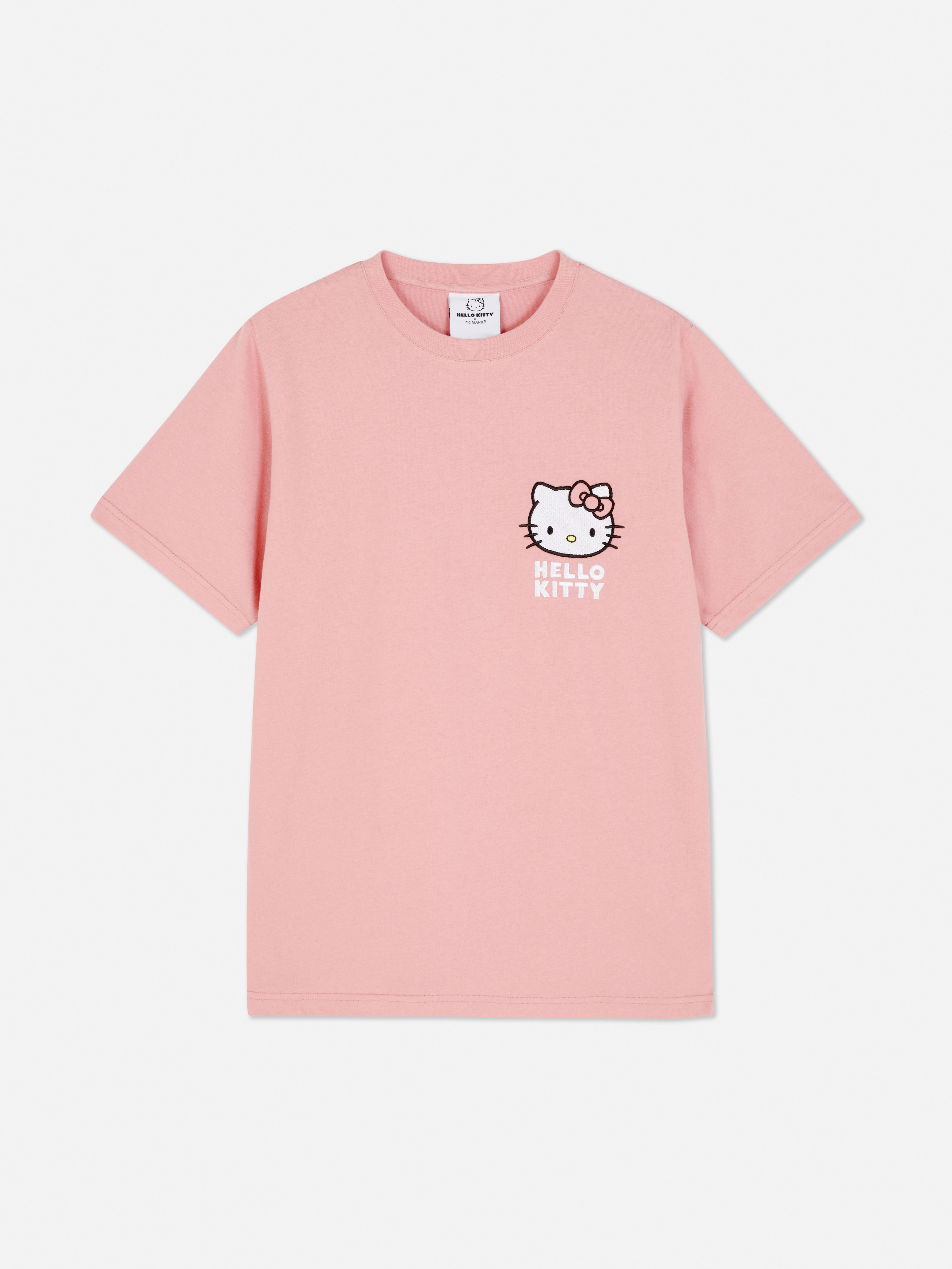 Tricou cu imprimeu Hello Kitty. Acest tricou supradimensionat cu Hello Kitty, cu decolteu rotund și mâneci scurte, este o piesă drăguță de bază.