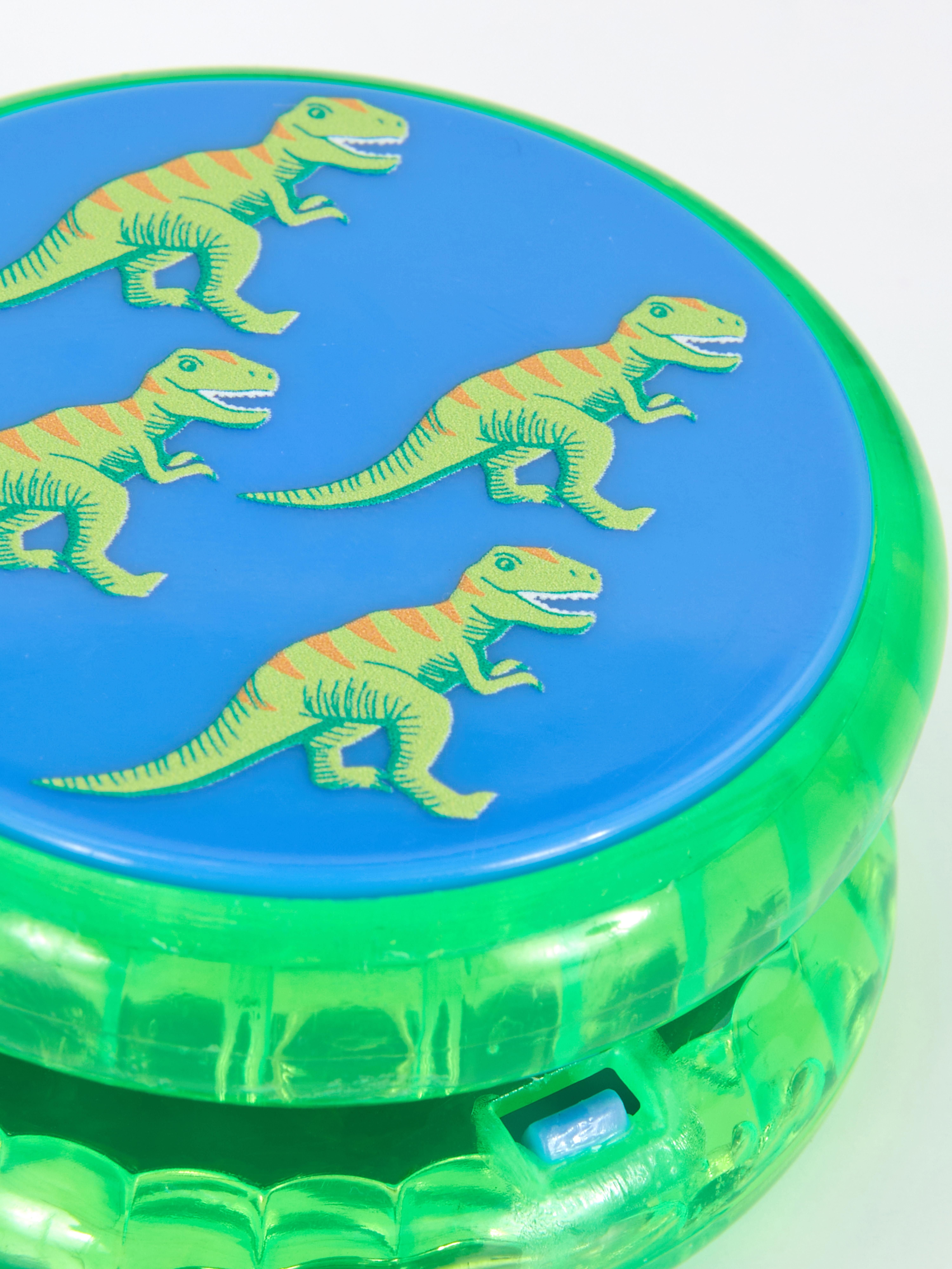 Yo-yo with dinosaur print and LED lighting. With this LED-lit dinosaur yo-yo, you'll never be bored again.