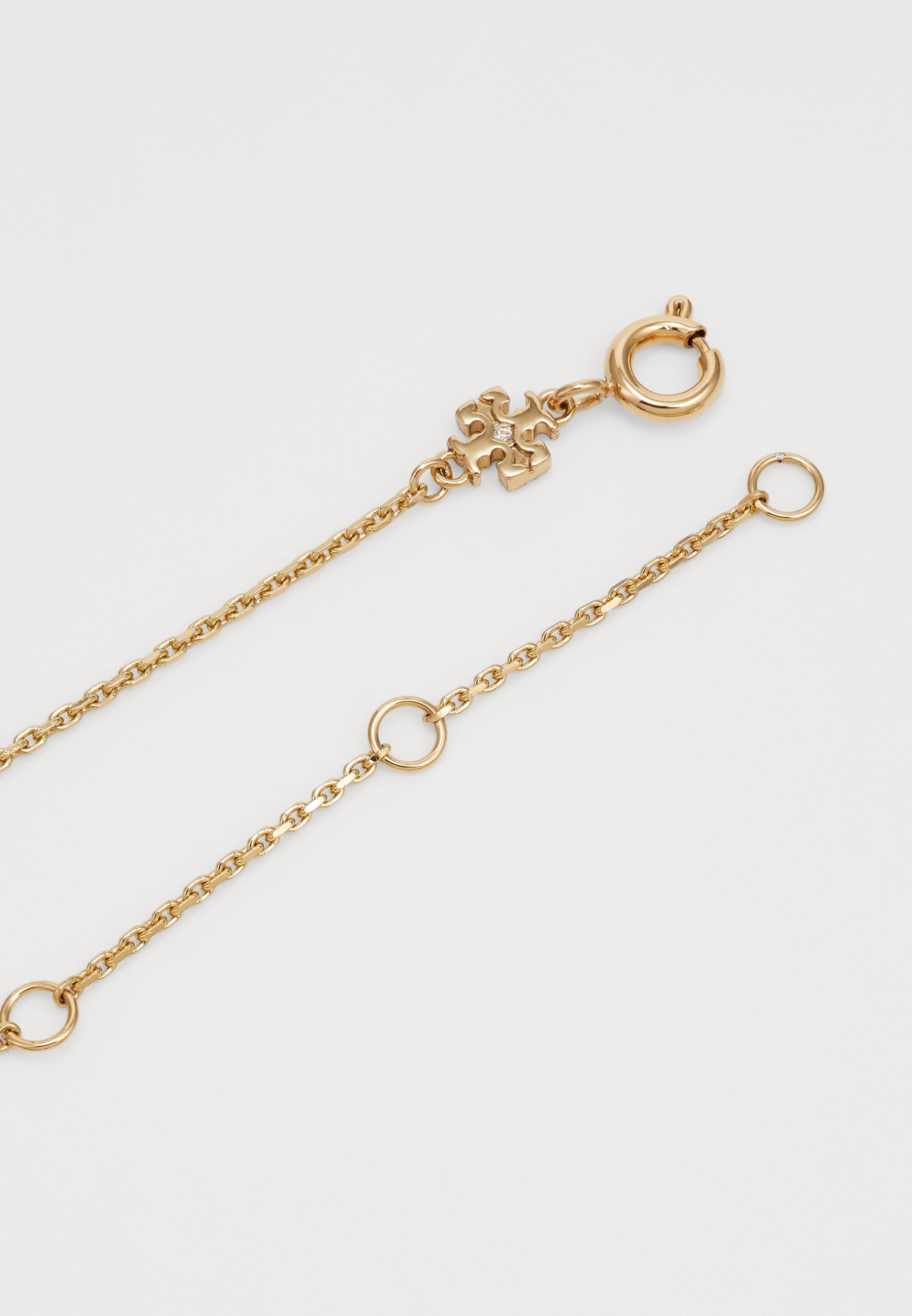 Collana Tory Burch SMALL WAVE PENDANT - ottone chiaro