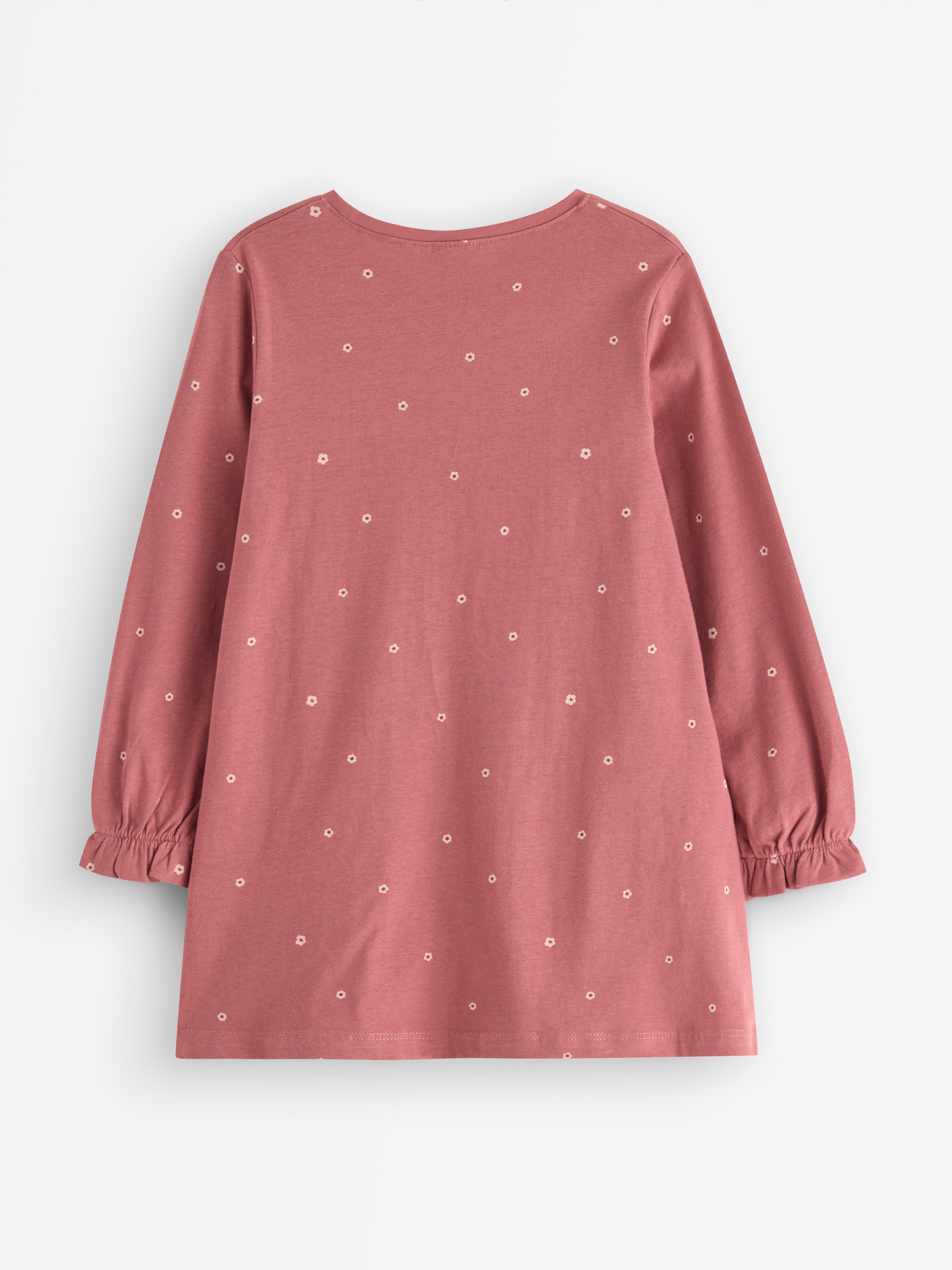 Túnica de manga comprida com bolsos divertidos. Rosa escuro acinzentado.