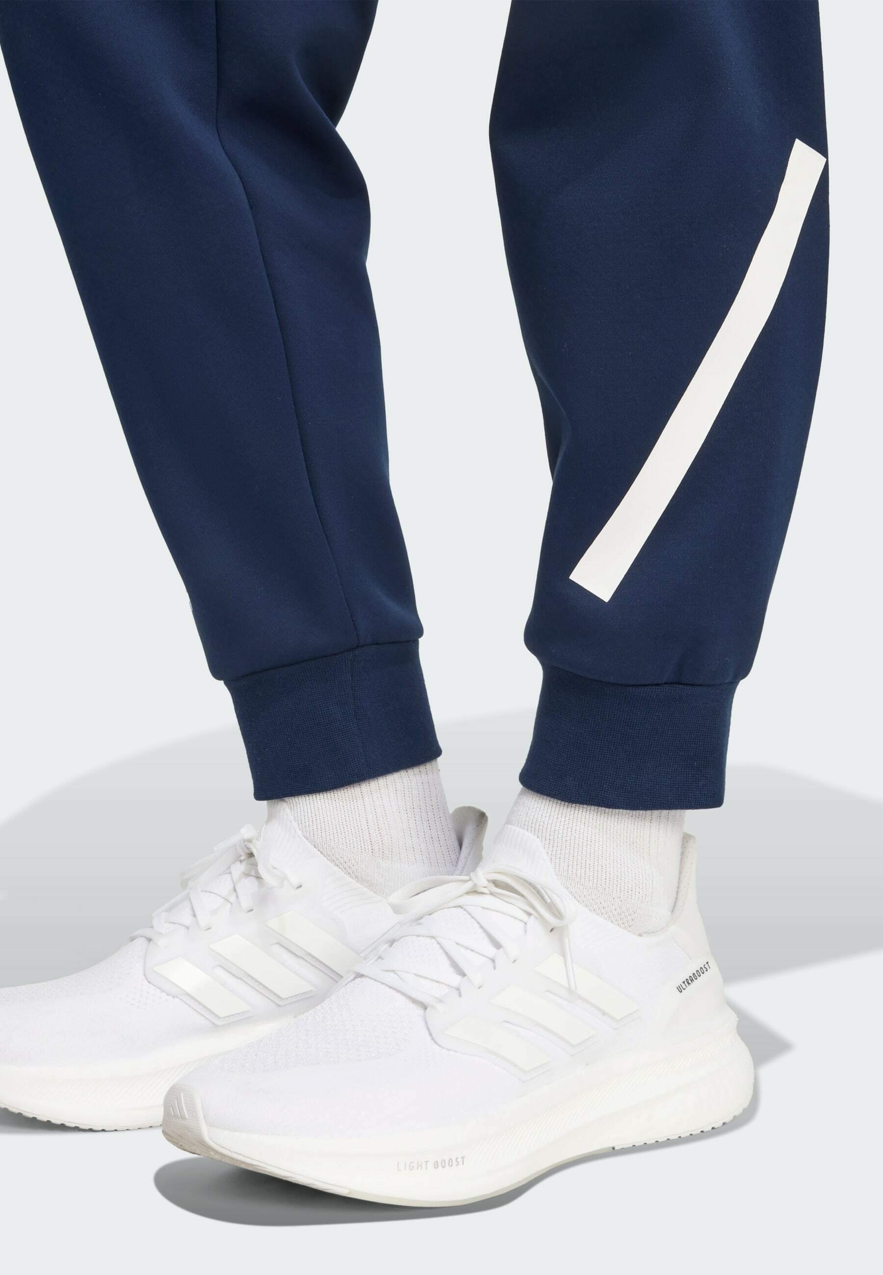 Teplákové kalhoty adidas Performance - tmavě modré