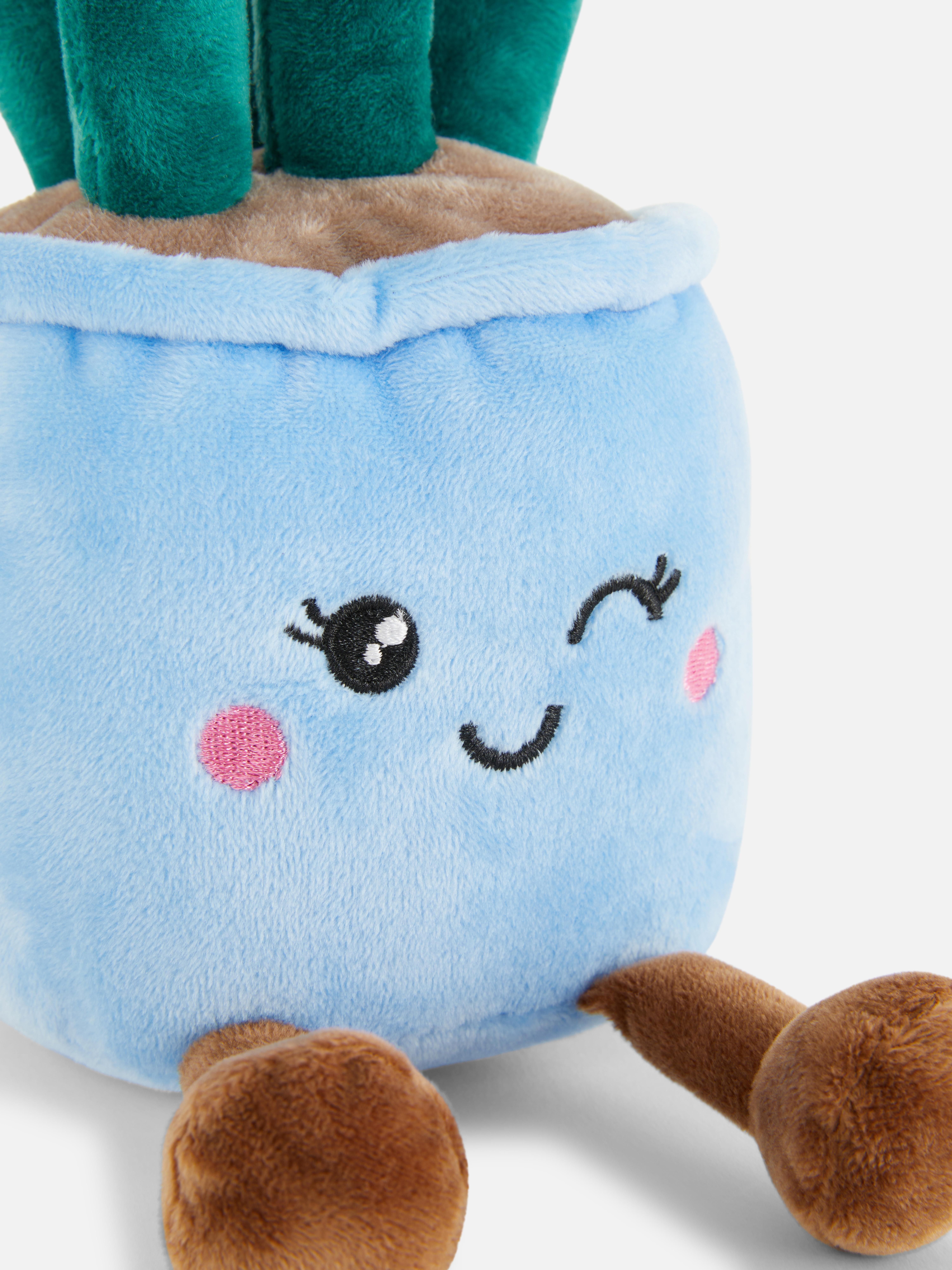 Tulipán plüssjáték Egy aranyos plüssjáték tulipánokkal díszített kaspó formájában