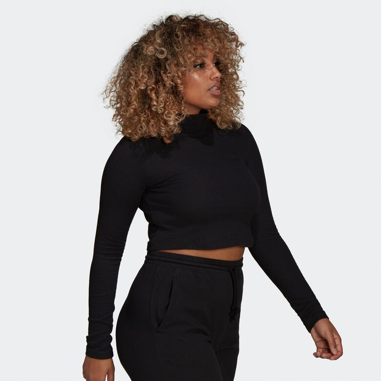 Cropped top met lange mouwen en ribstof, ideaal voor de winter.