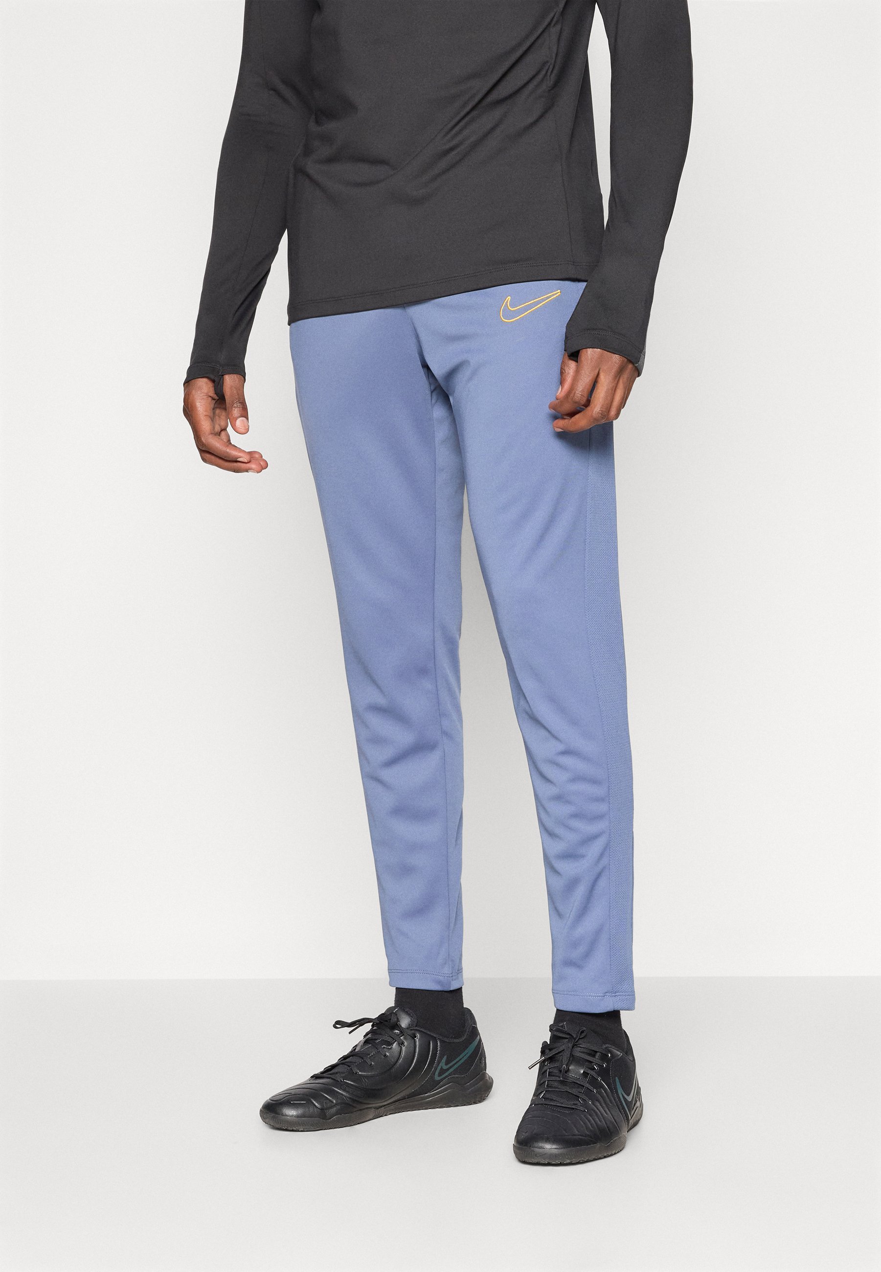 Spodnie dresowe Nike Performance ACADEMY PANT - rozproszony niebieski/złoty uniwersytecki