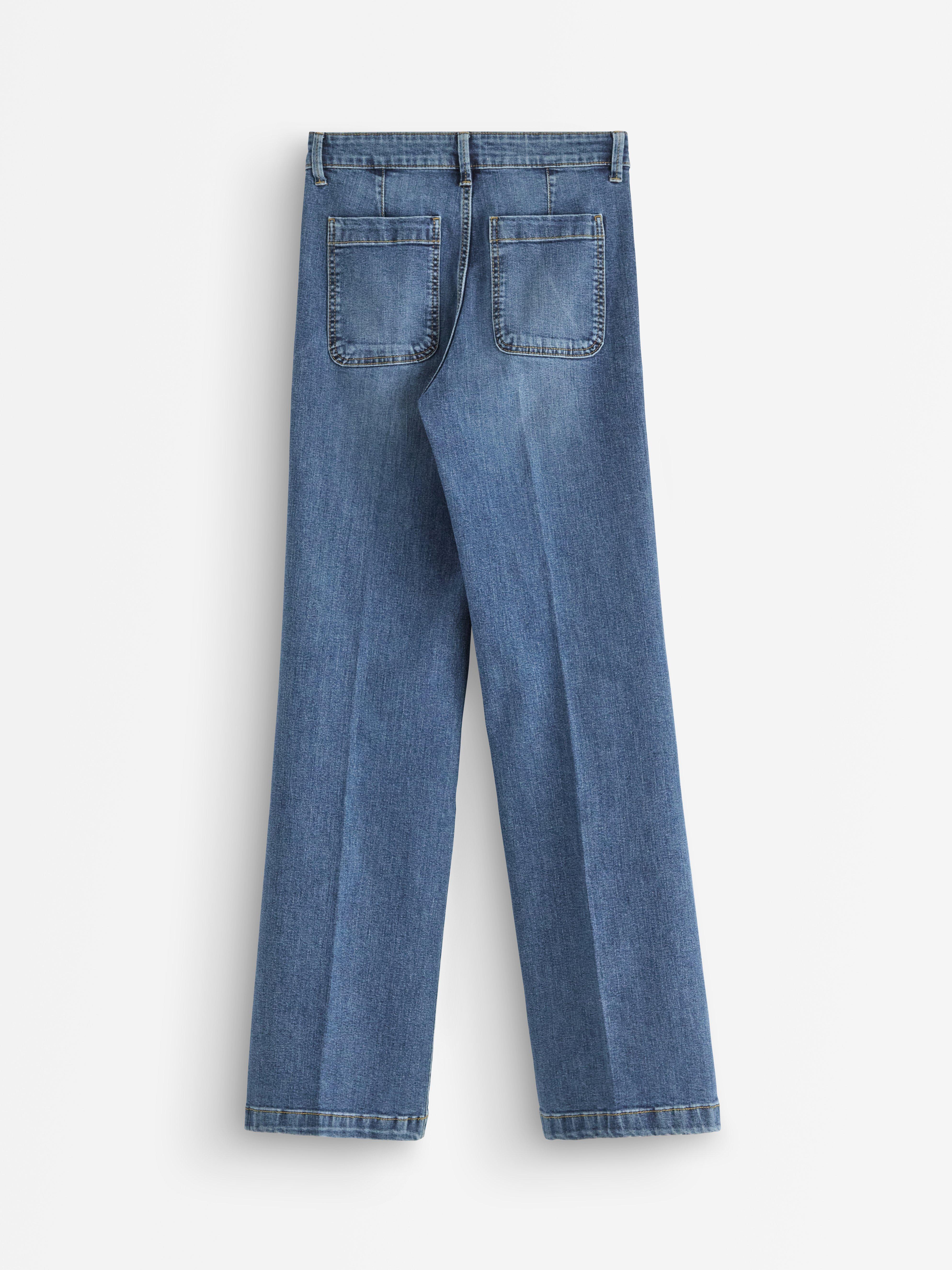 Vaqueros elásticos de pierna ancha, denim medio.