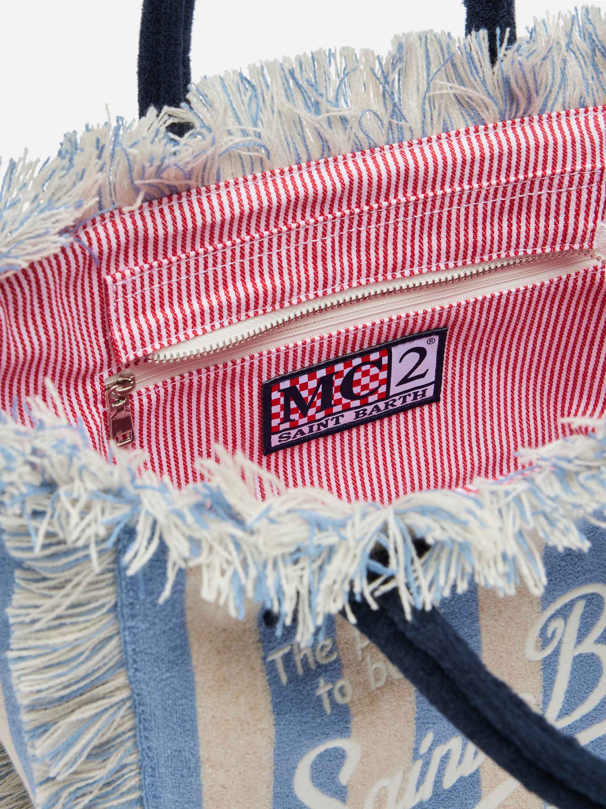 Bolsa Colette em tecido esponja com estampa listrada azul.