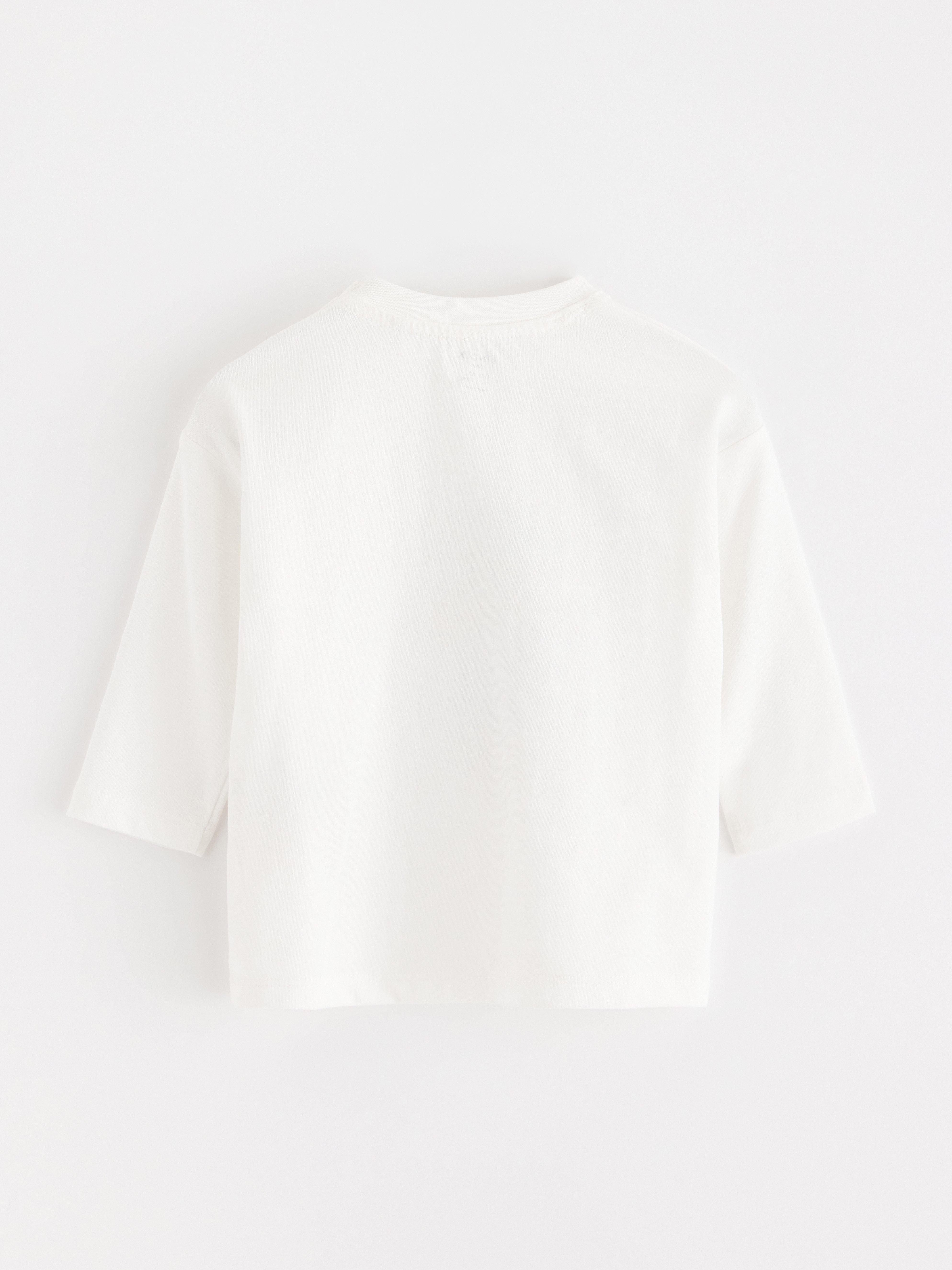Top de manga larga color blanco claro empolvado