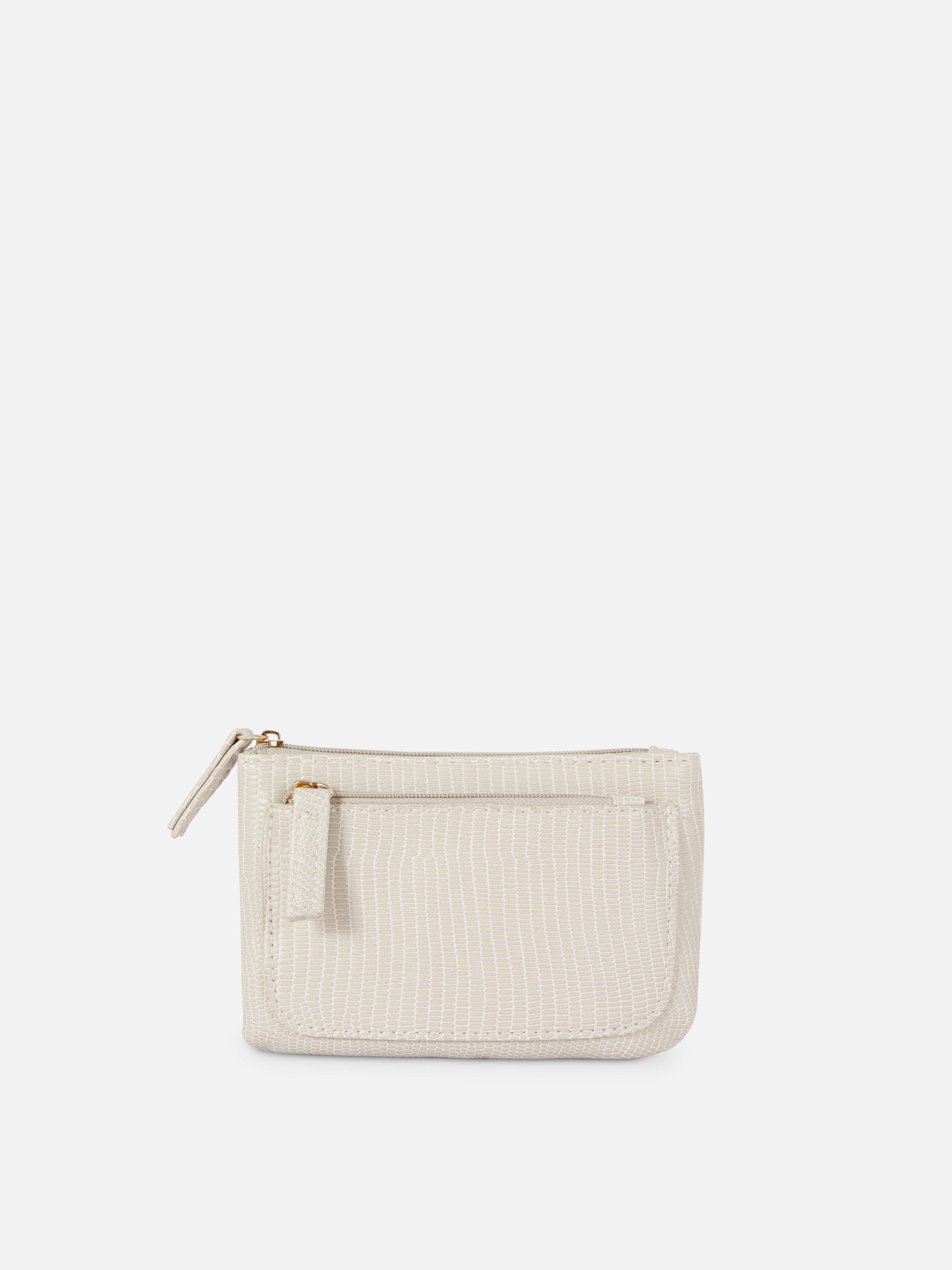 Handtasche in Schlangenoptik. Modische und funktionelle Handtasche mit Reißverschluss, strukturierter Oberfläche und mehreren Fächern.