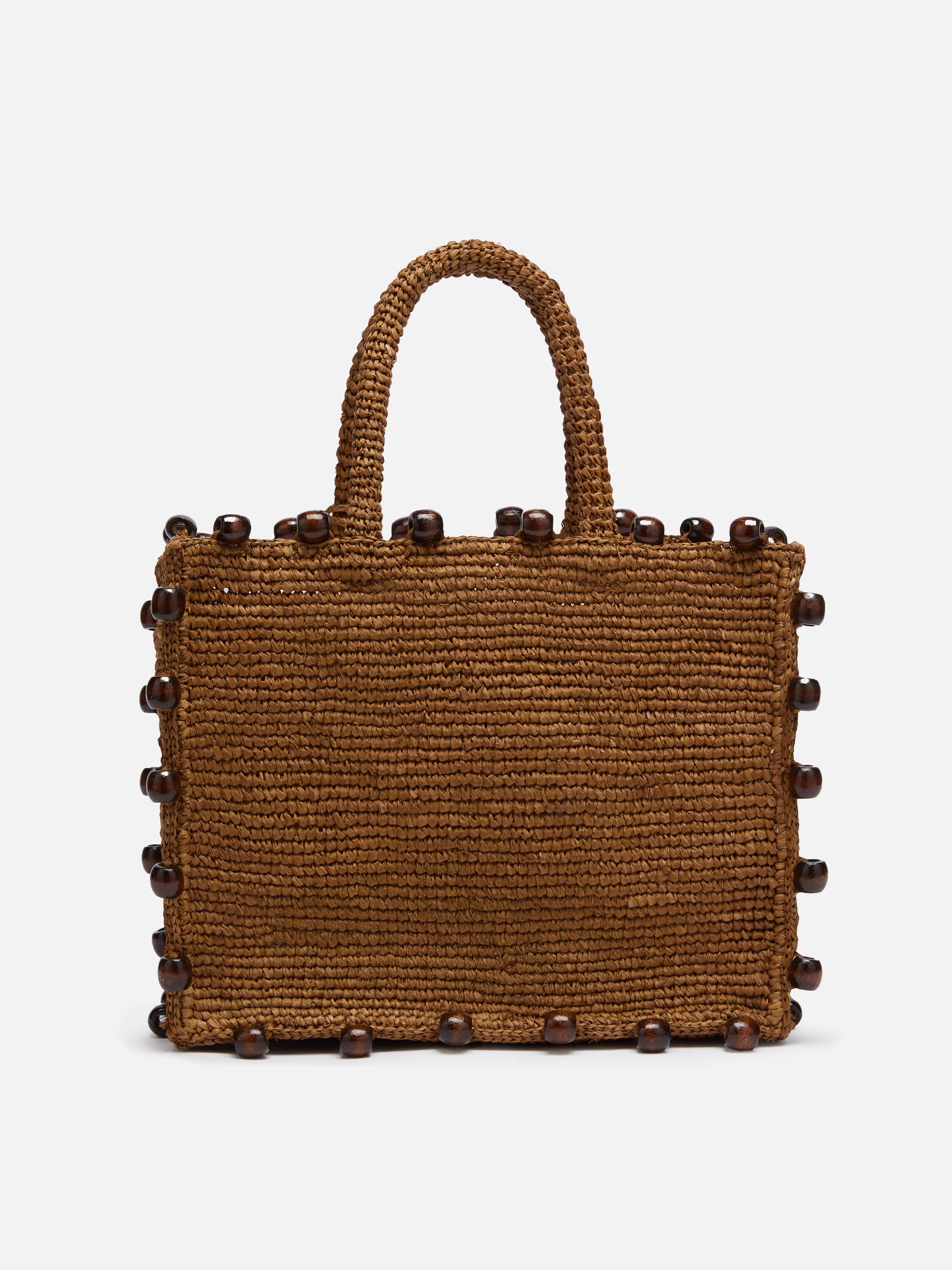 Colette tas van bruin raffia met kralen en geborduurd logo.