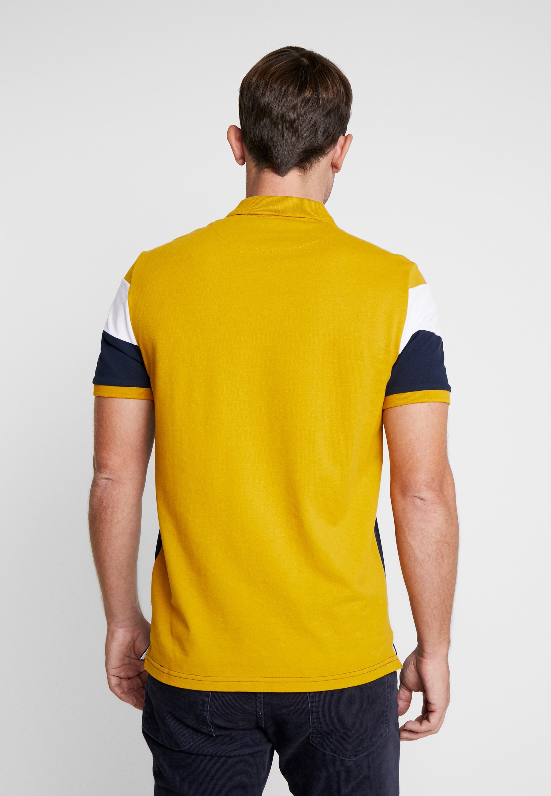 Pier One SLIM - Polo - bleu foncé/moutarde