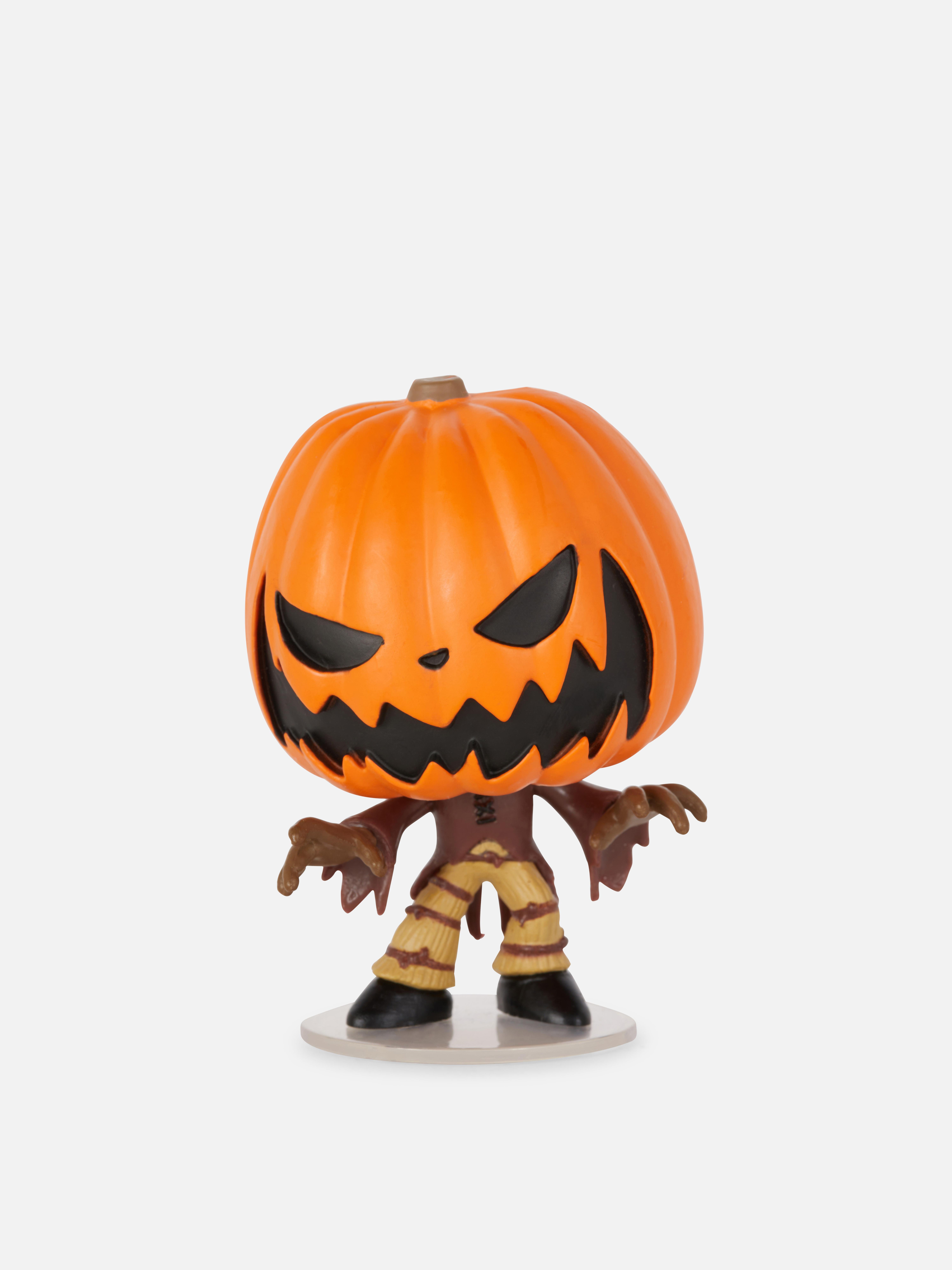 Figurină Funko Minis Disney Coșmarul dinaintea Crăciunului. O figurină Regele Dovleac într-un ambalaj cadou înfricoșător.