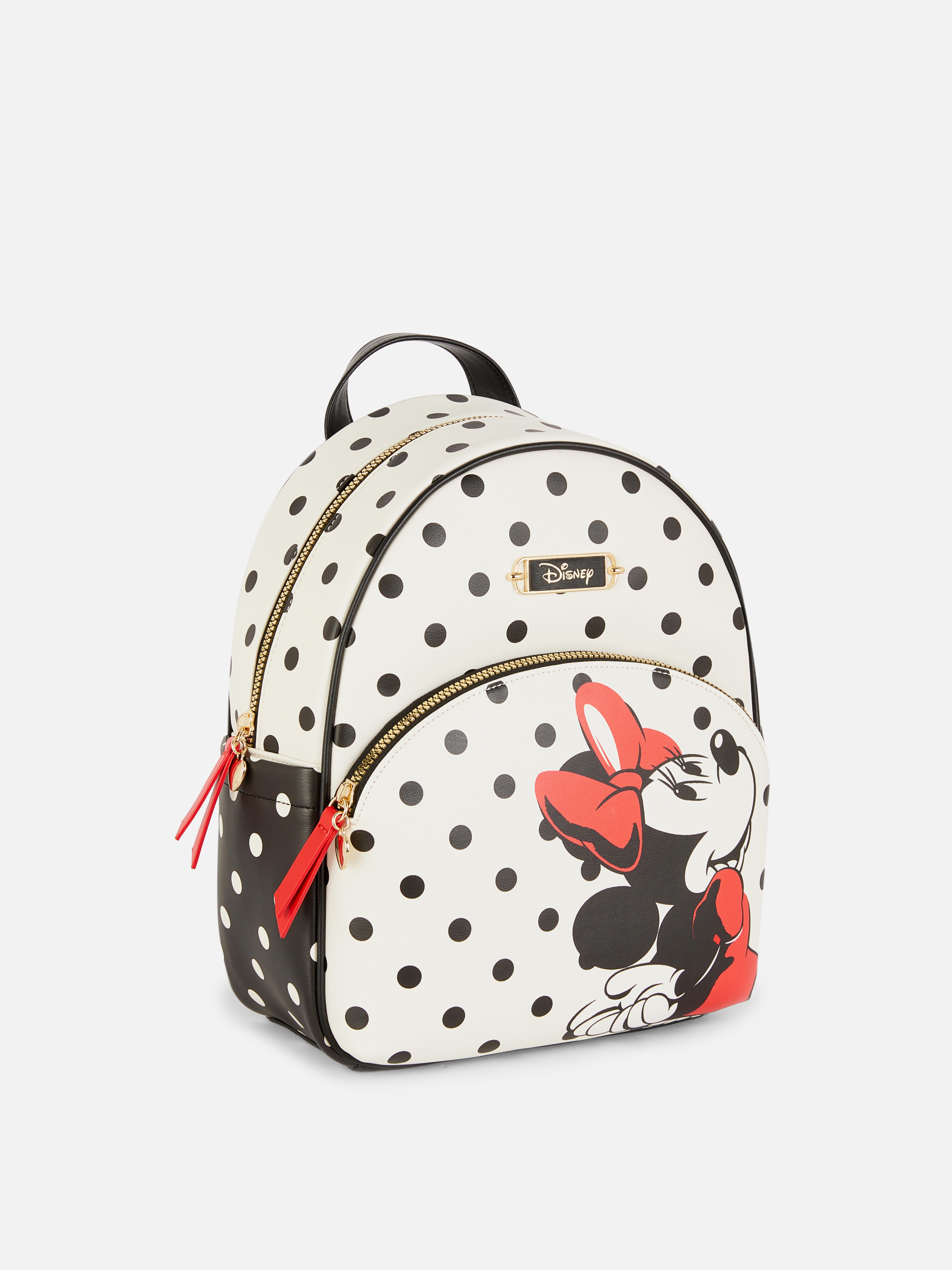 Disney Minnie Mouse Polka Dot Rucksack: Ein Rucksack aus Kunstleder mit Vordertasche, verstellbaren Schultergurten und Reißverschluss oben.